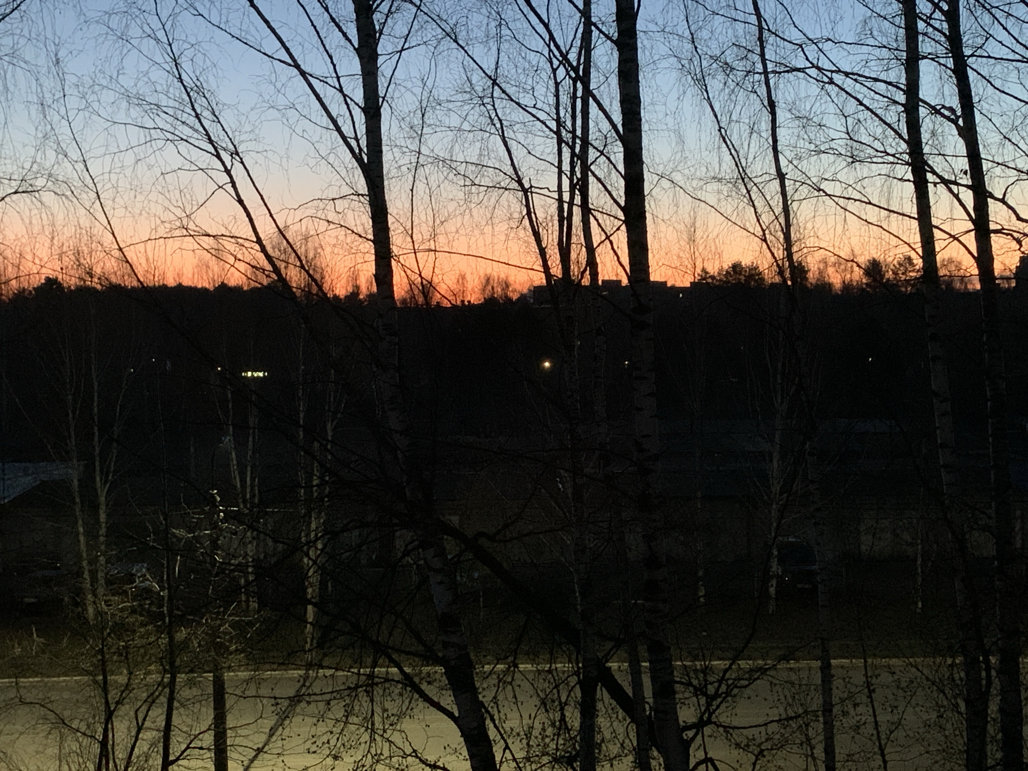 Evening moments captured in Chaikovsky: sunset and elderly woman resting