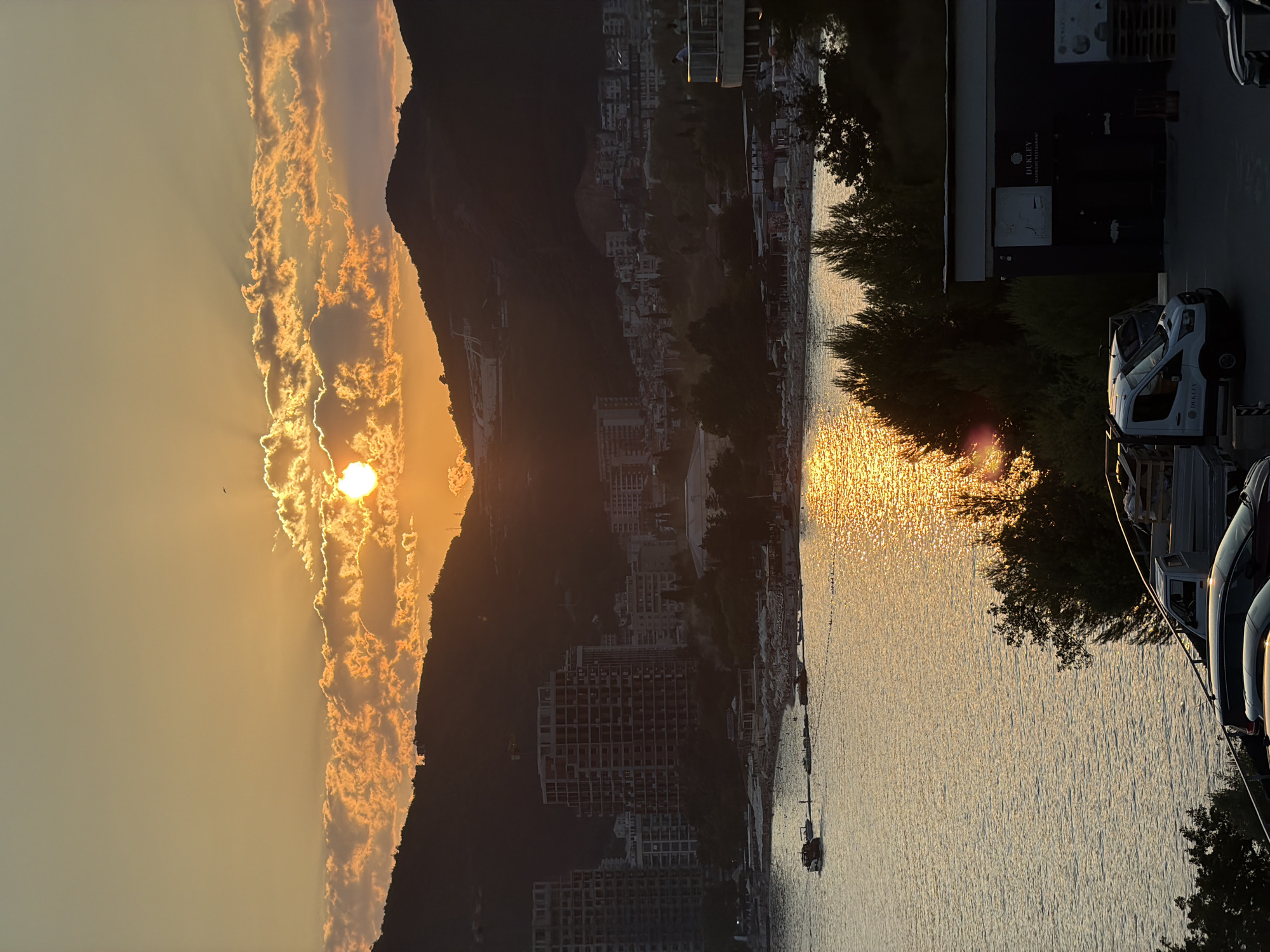 Golden sunset over Boreti's coastline and hillside resort