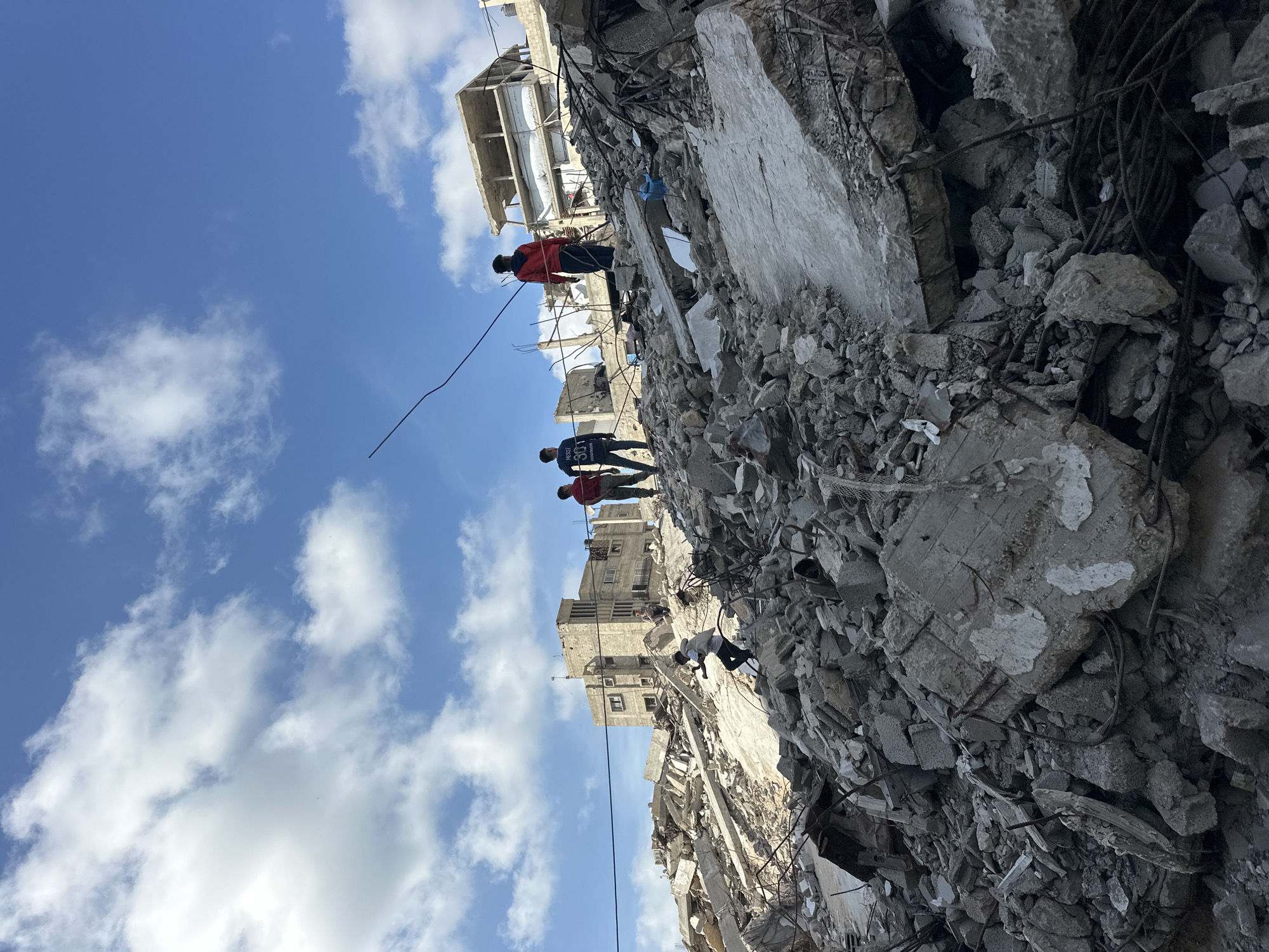 Building collapse and search operations documented in Gaza