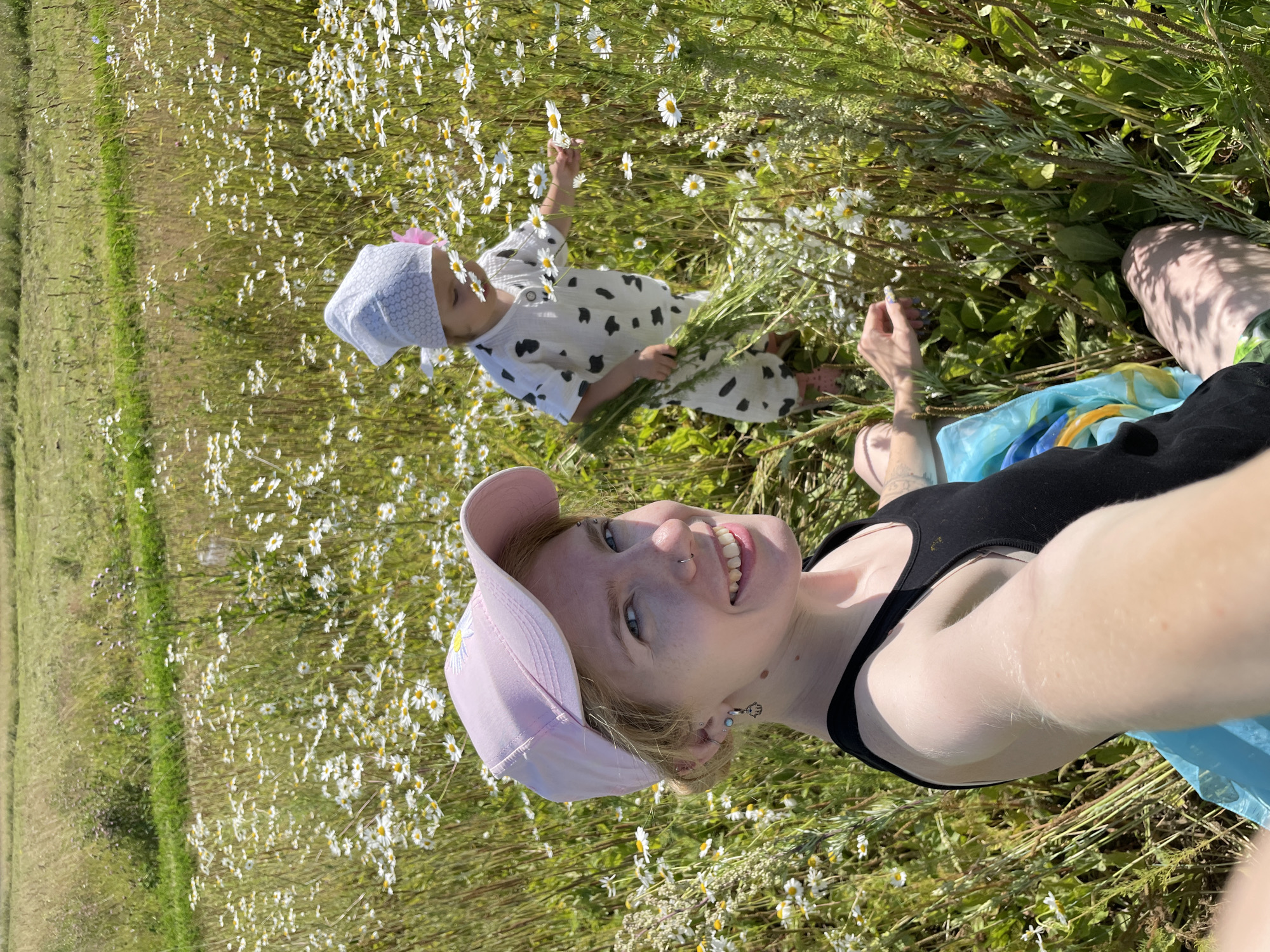 Picking daisies in a sun-filled Russian field