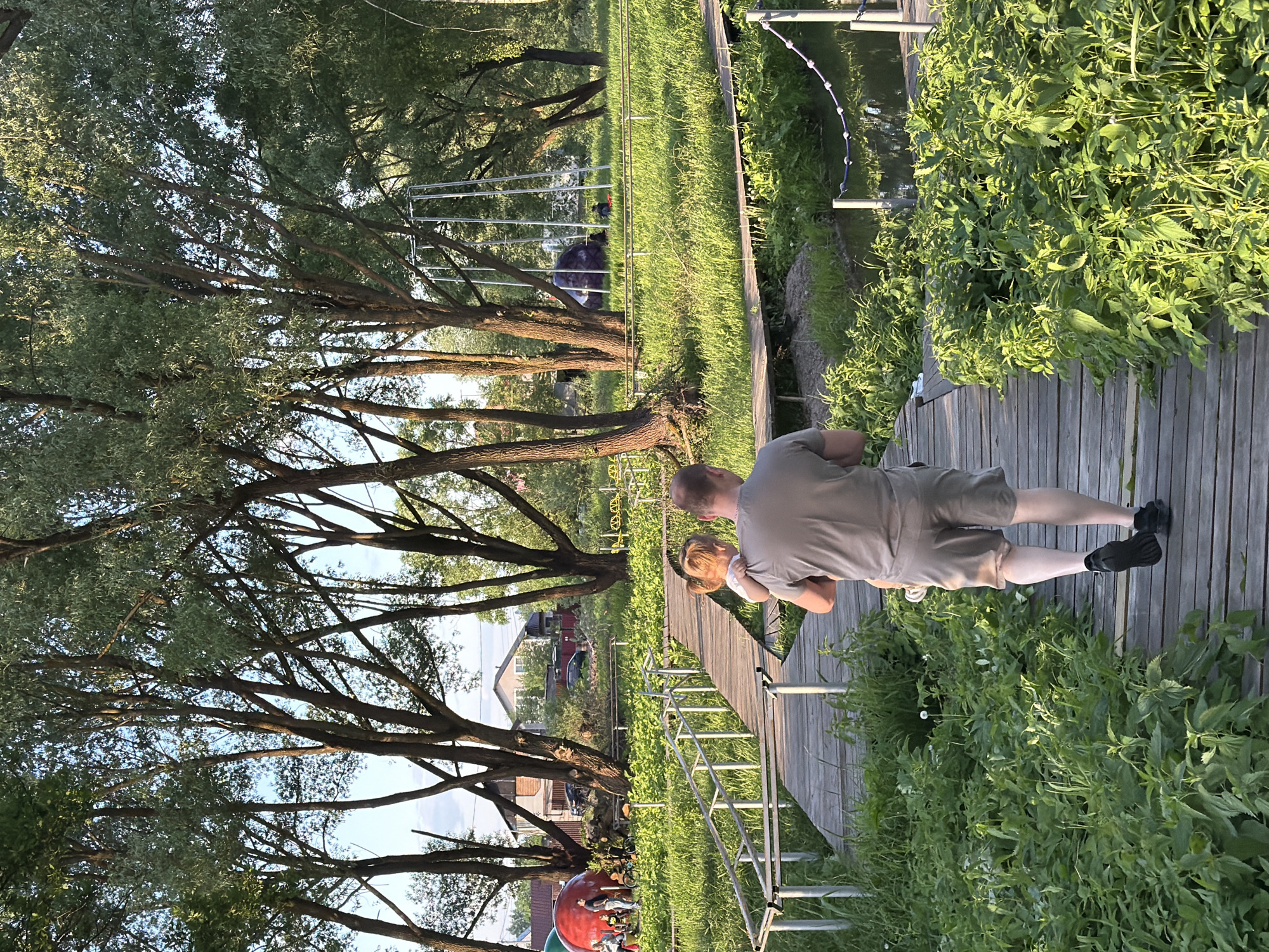 Family enjoys afternoon playground visit in Sin'kovo, Russia