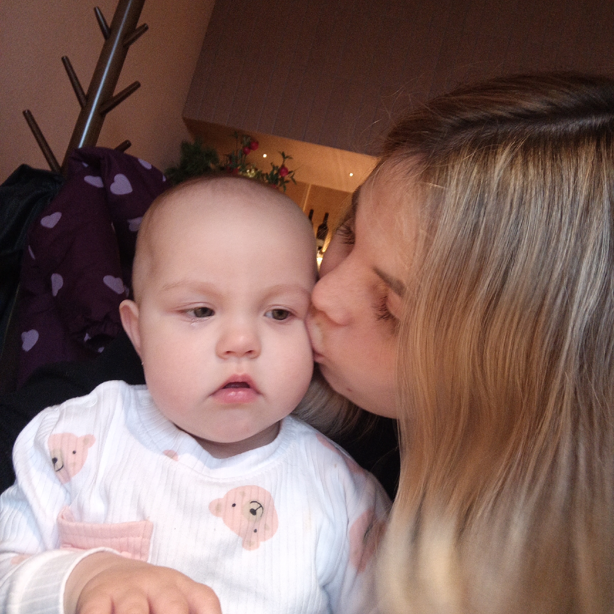 Family shares tender cafe moments with baby during morning outing
