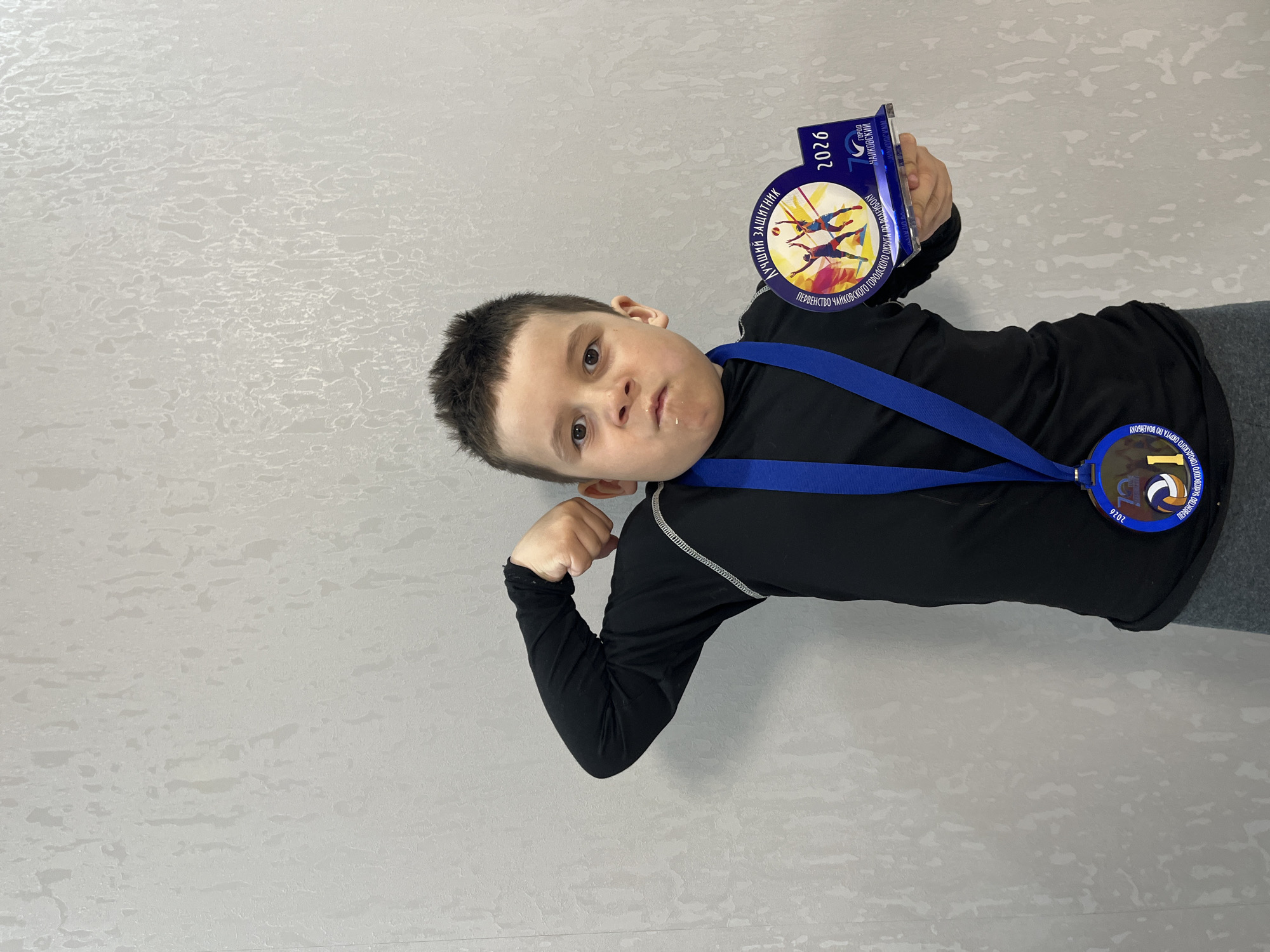 Children celebrate volleyball championship medals in Chaikovsky, Russia