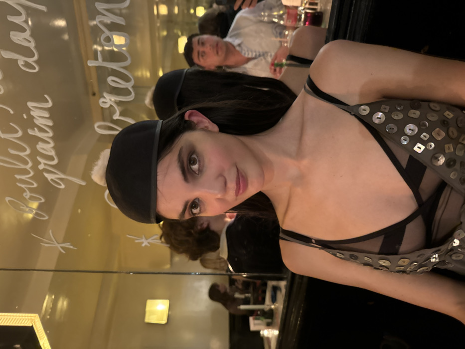 Dinner party with wine and children's artwork in Paris