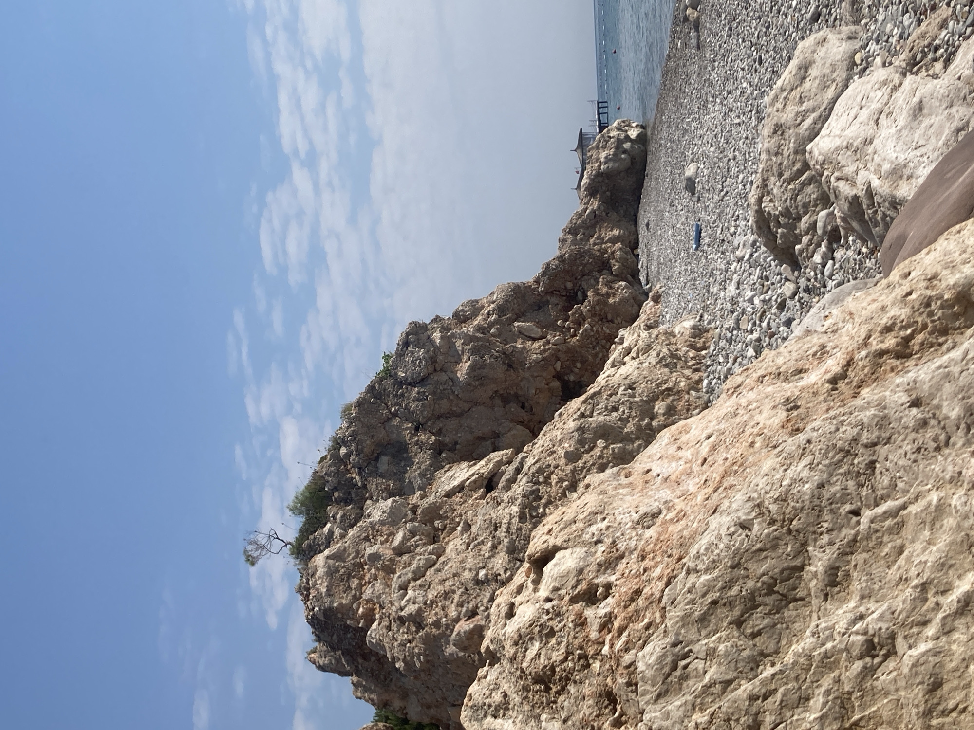 Morning at a rocky Kemer beach, swimming and shoreline details