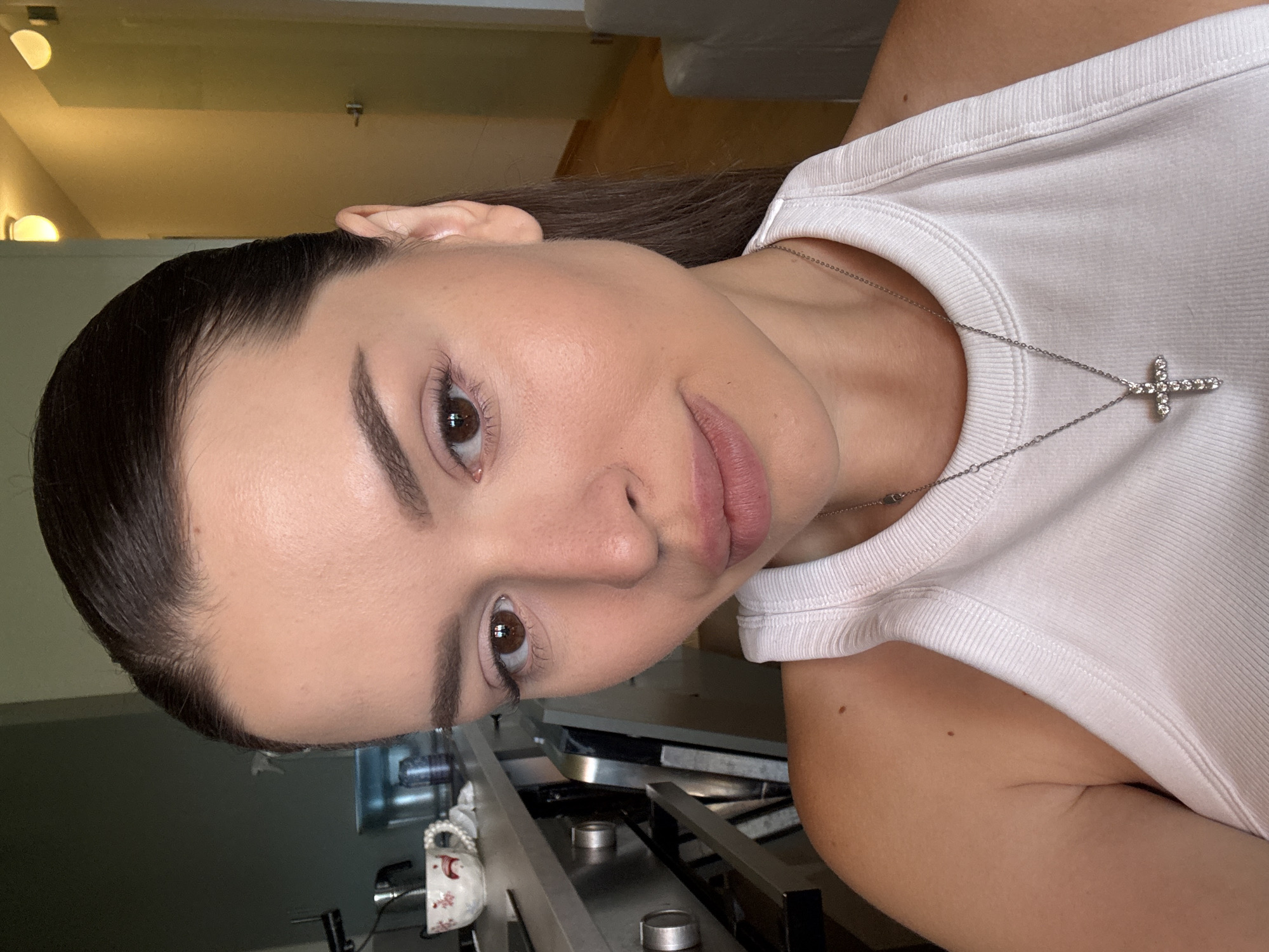 Close-up selfie series in Prague, white tank top and cross necklace