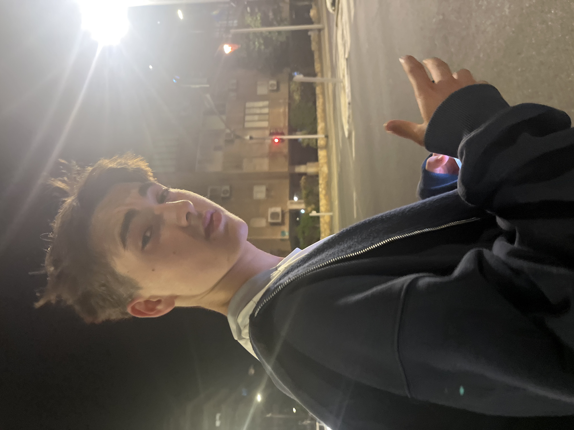 Young man photographed outdoors at night in Ramat Gan