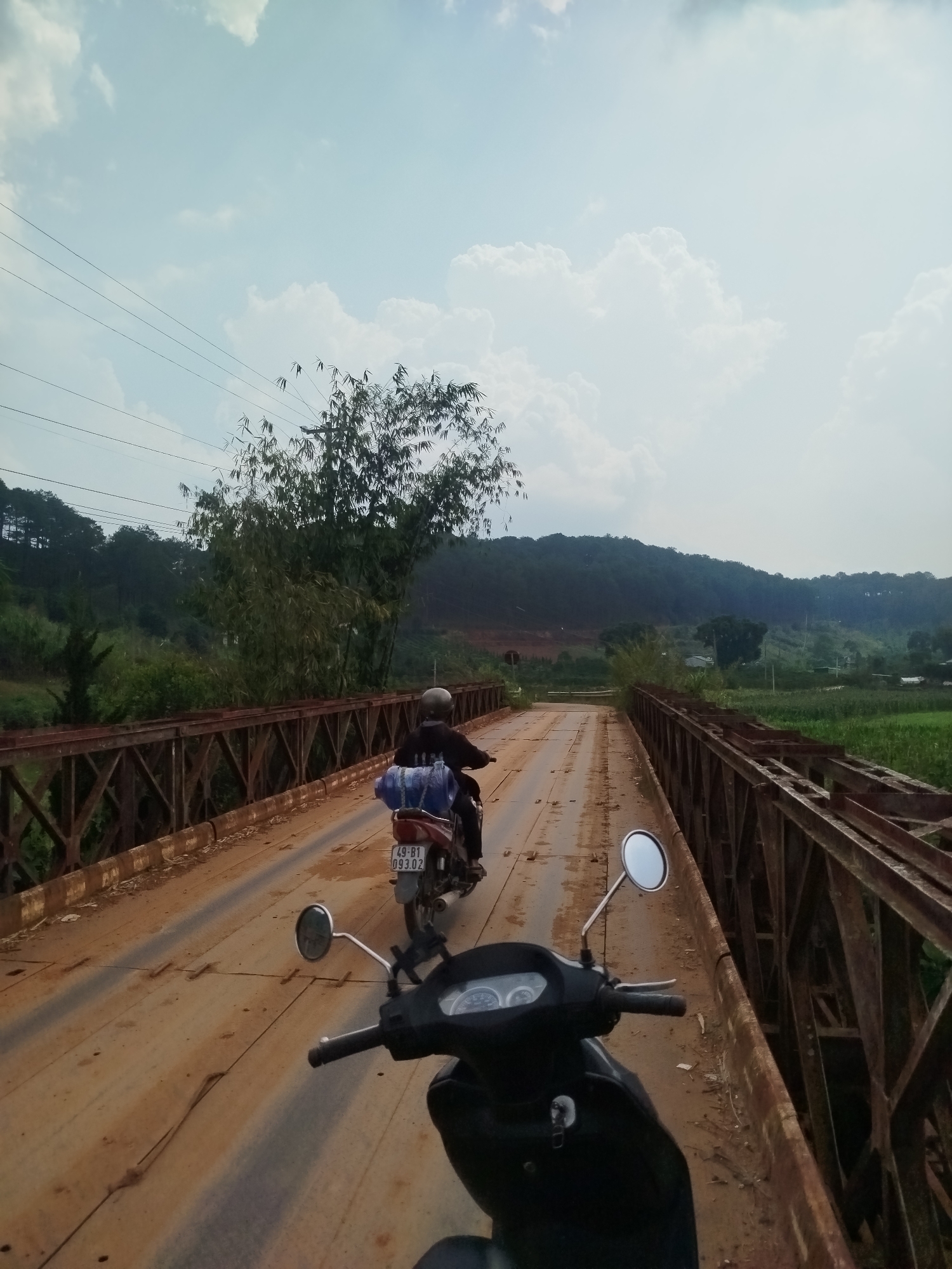Rural Vietnam landscape and bridge crossing documented by witness