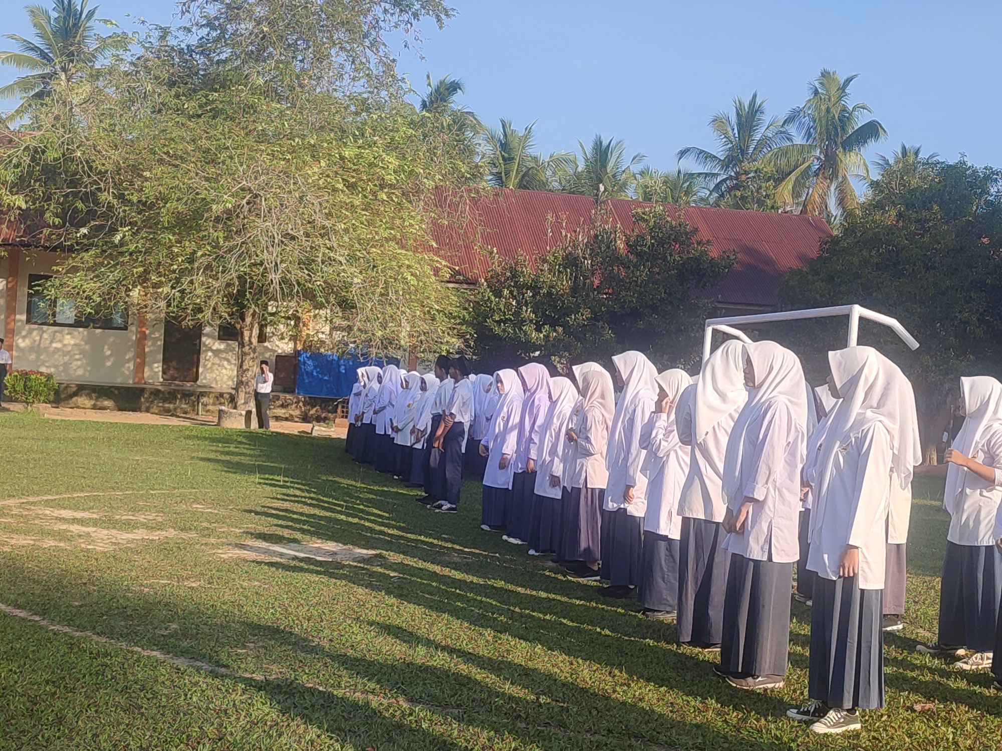 Indonesian students conduct morning flag ceremony at Blangriek school
