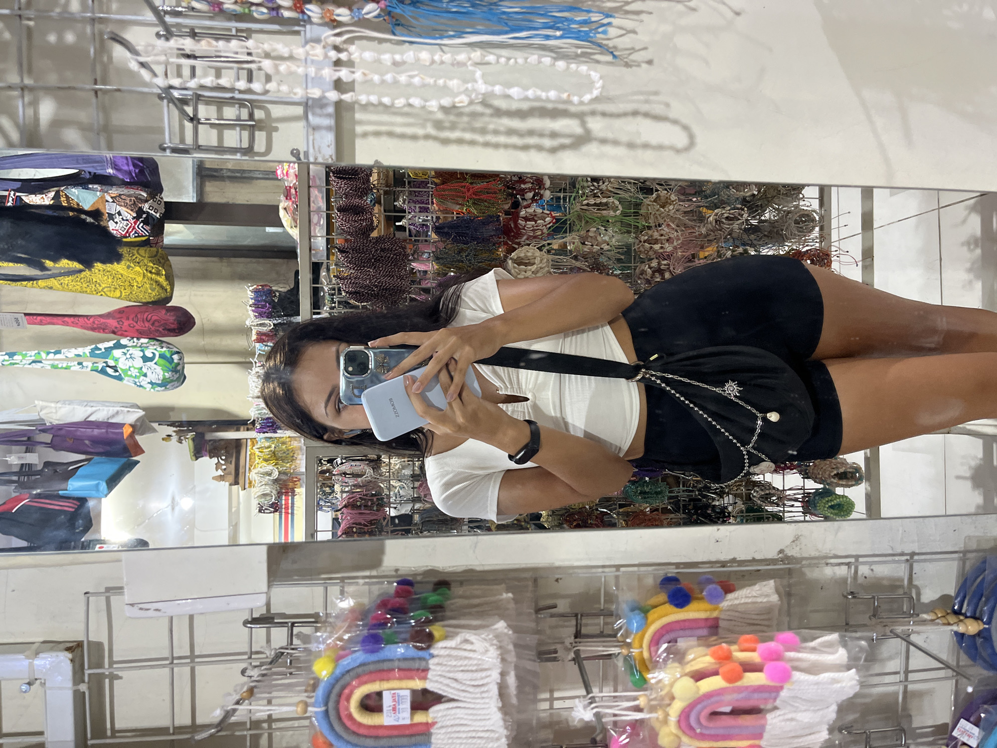 Woman shops and takes selfies at craft store in Indonesia