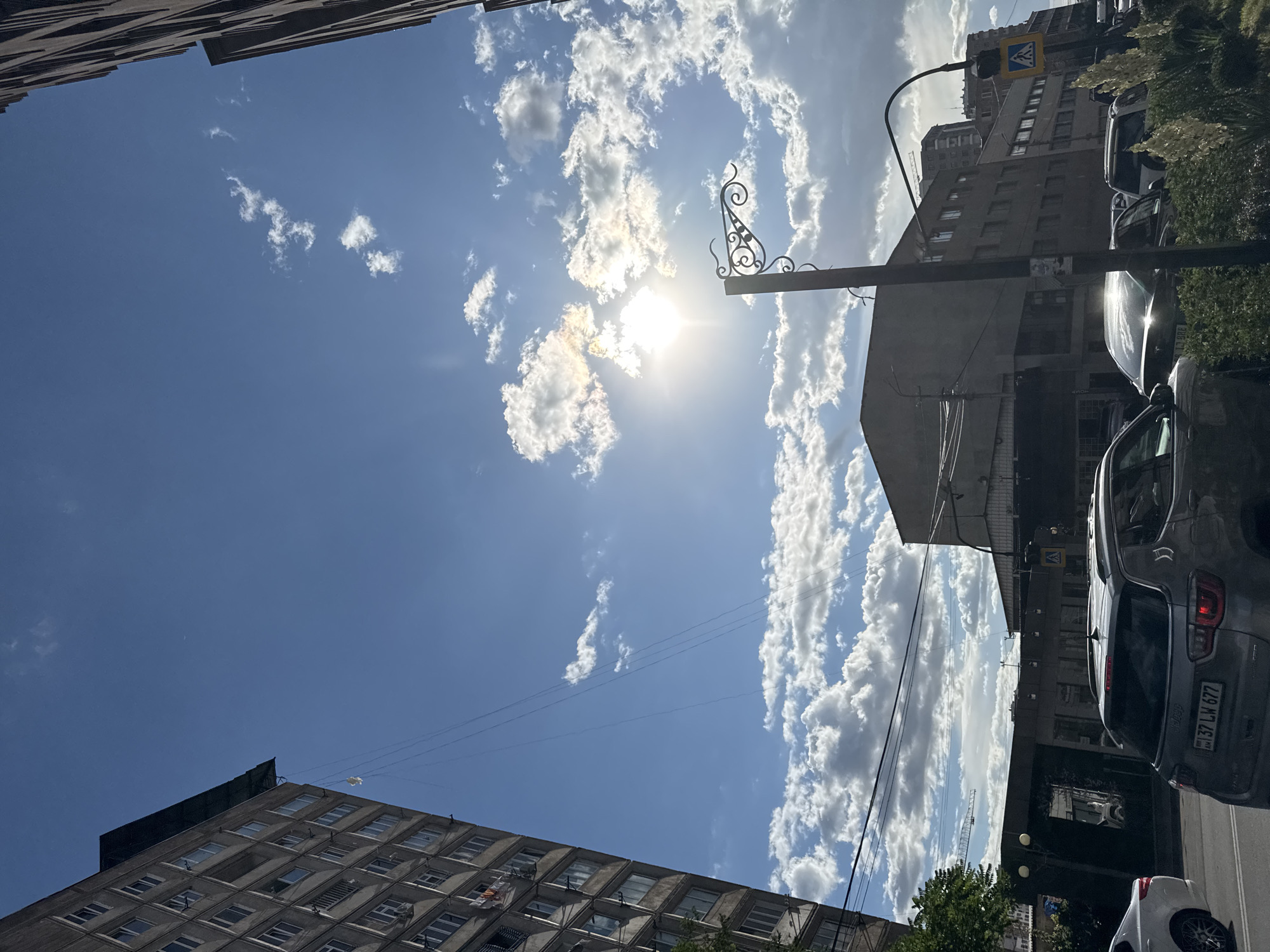 Urban scenes and parked vehicles in Armenian city