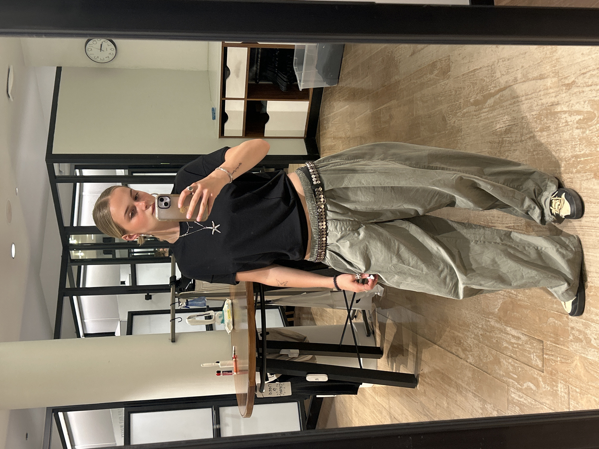 Person takes selfies in Whistler retail store early morning