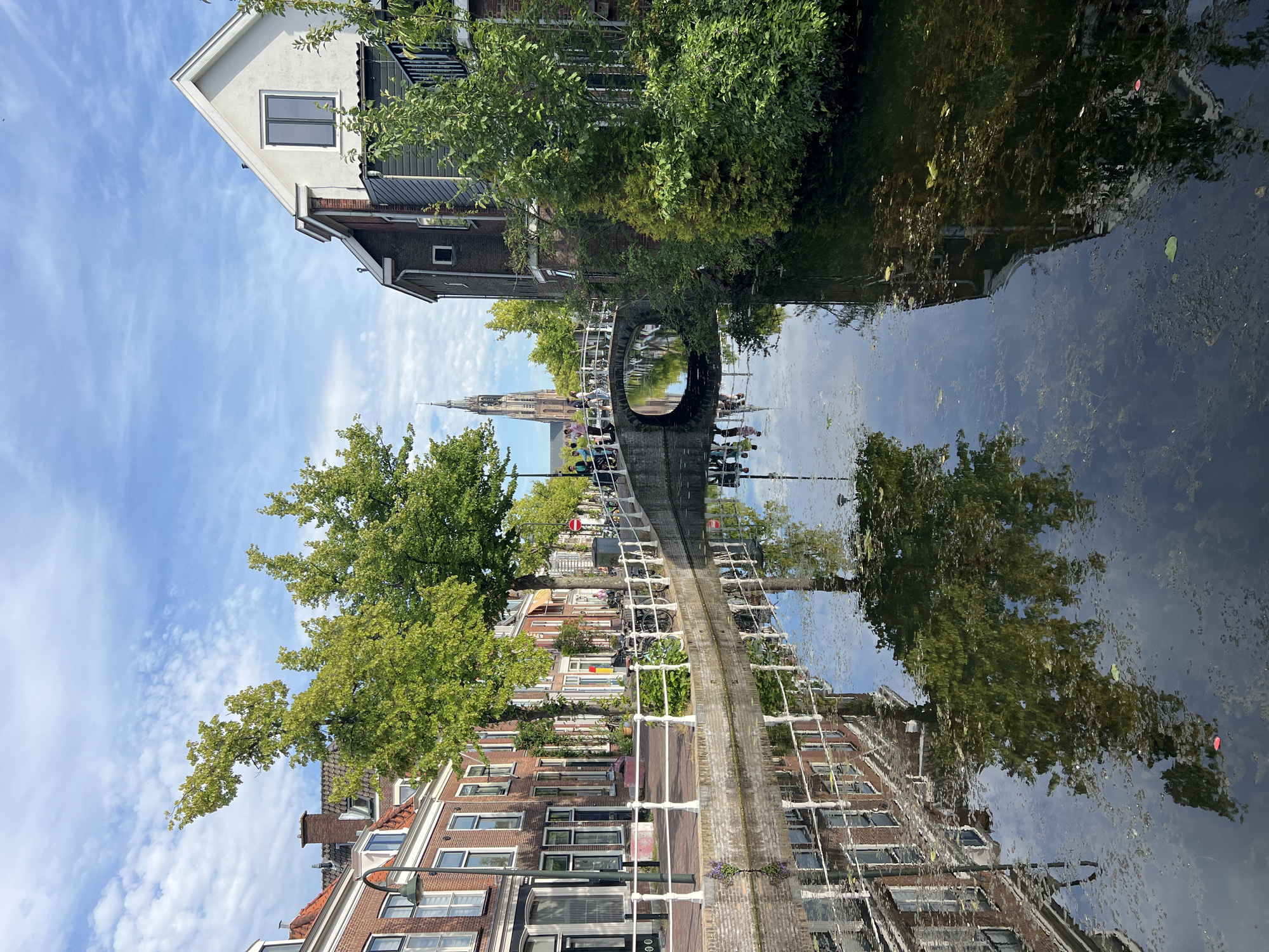 Quiet canal scene along the streets of Delft