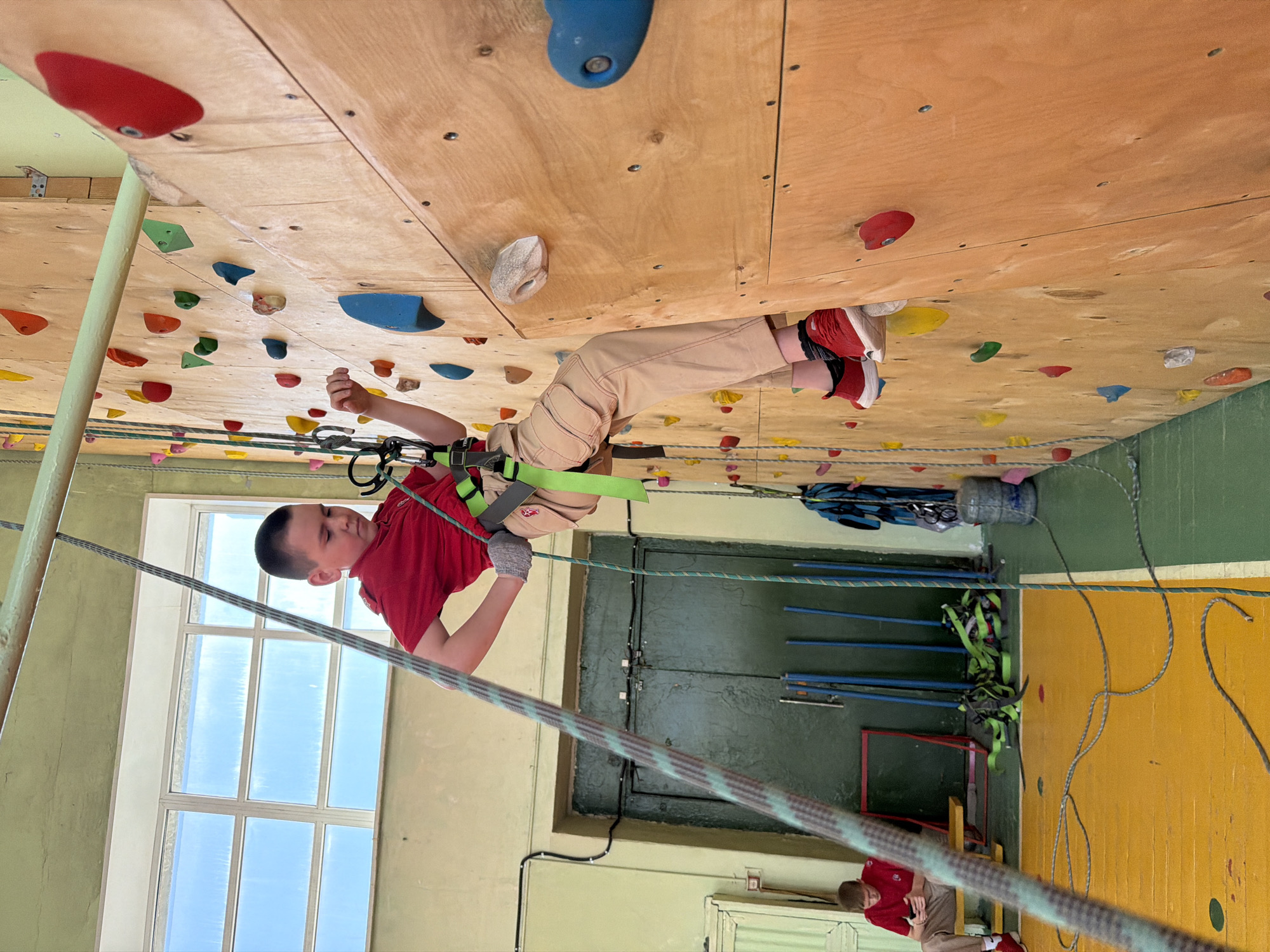 Children practice indoor rock climbing at Izhevsk center