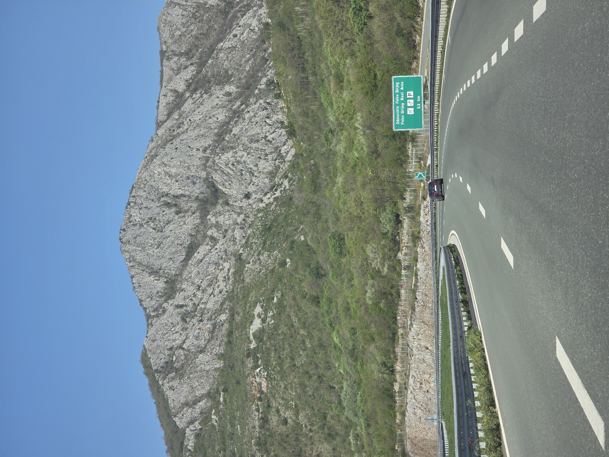 Highway rest area sign spotted on mountain road in Montenegro