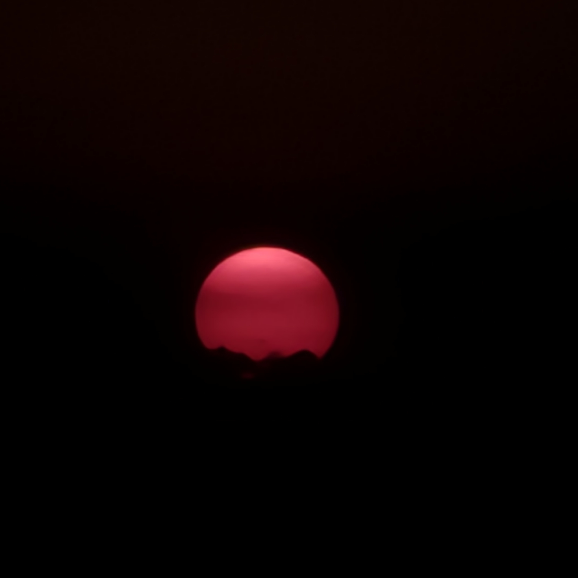Pink and red sunset settling over the Novi Ligure countryside