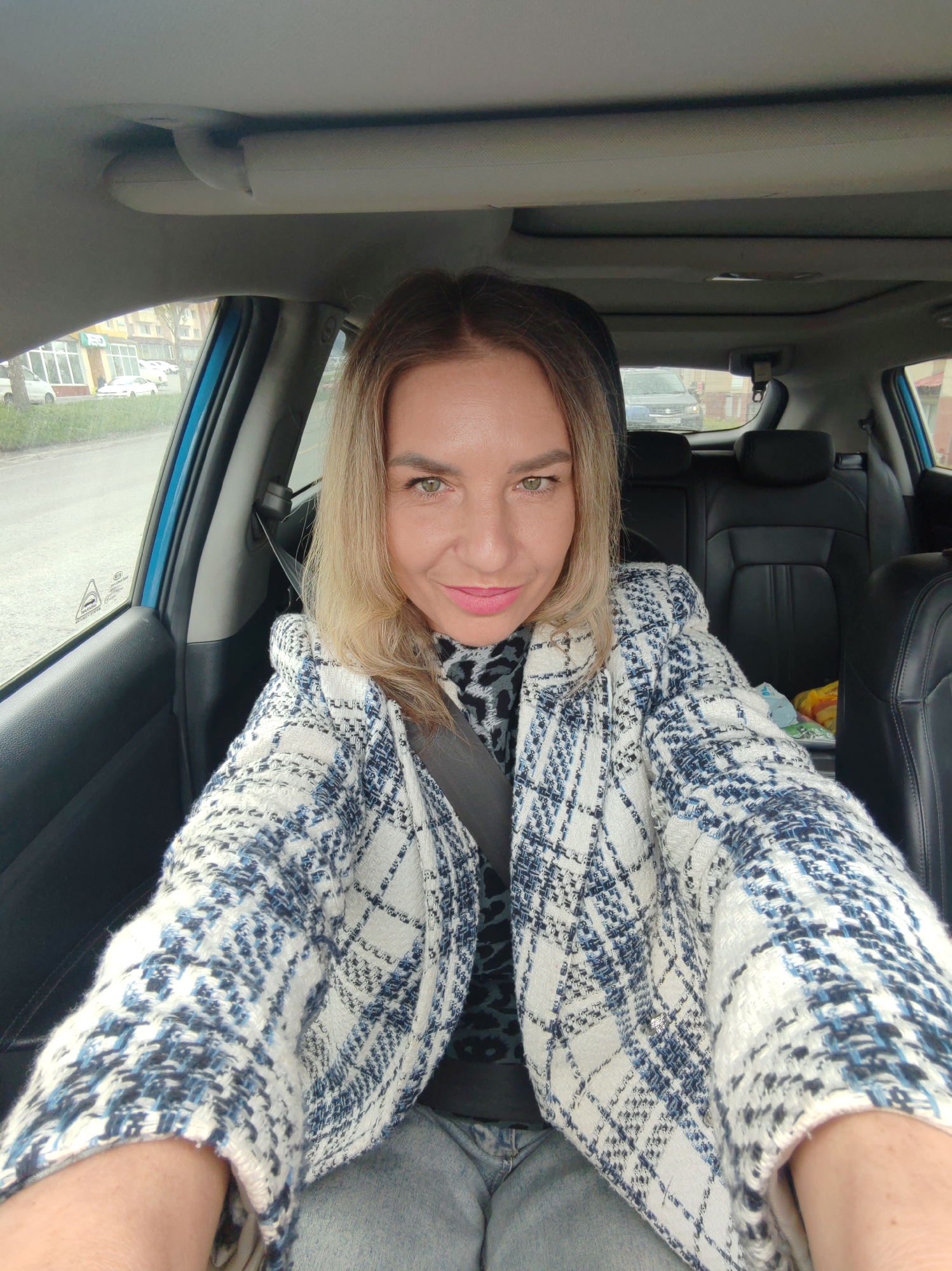 Woman takes car selfies in Petropavlovsk-Kamchatsky