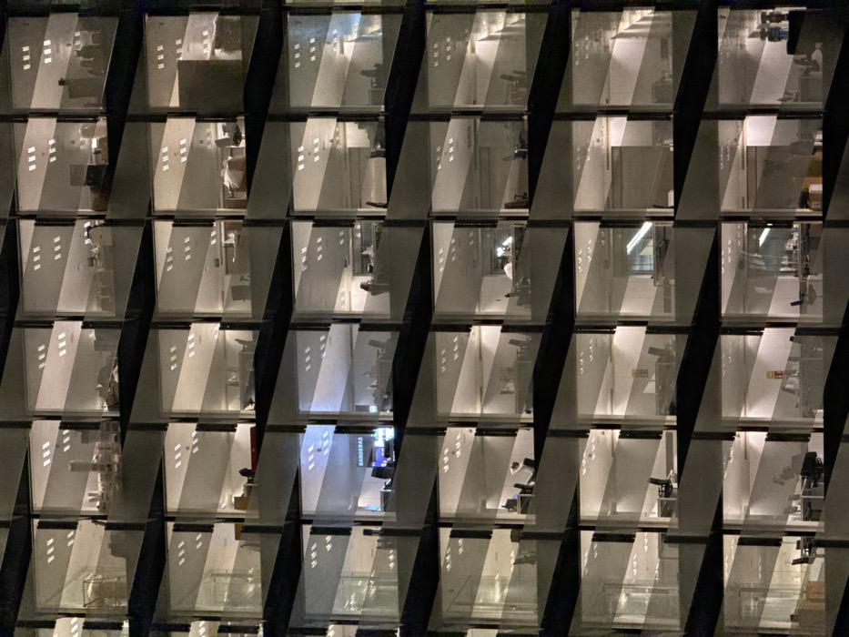 Office buildings illuminate evening grid in l'Hospitalet de Llobregat