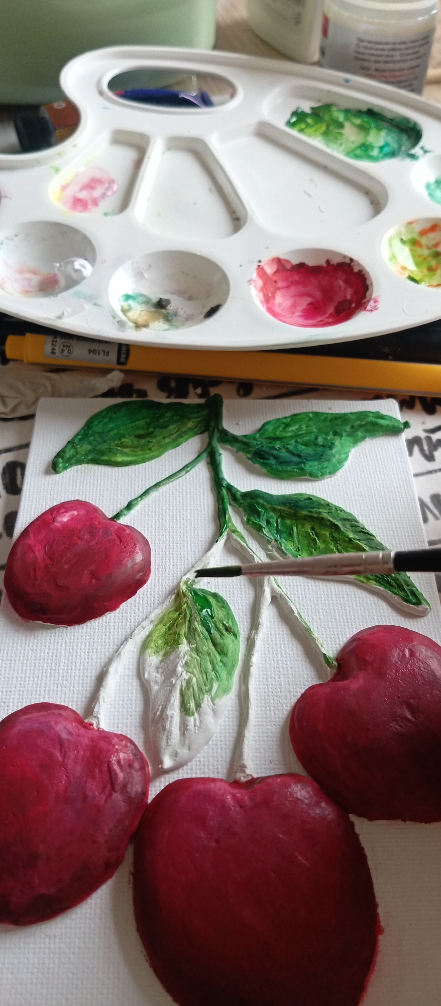 Artist documents cherry painting session and craft work