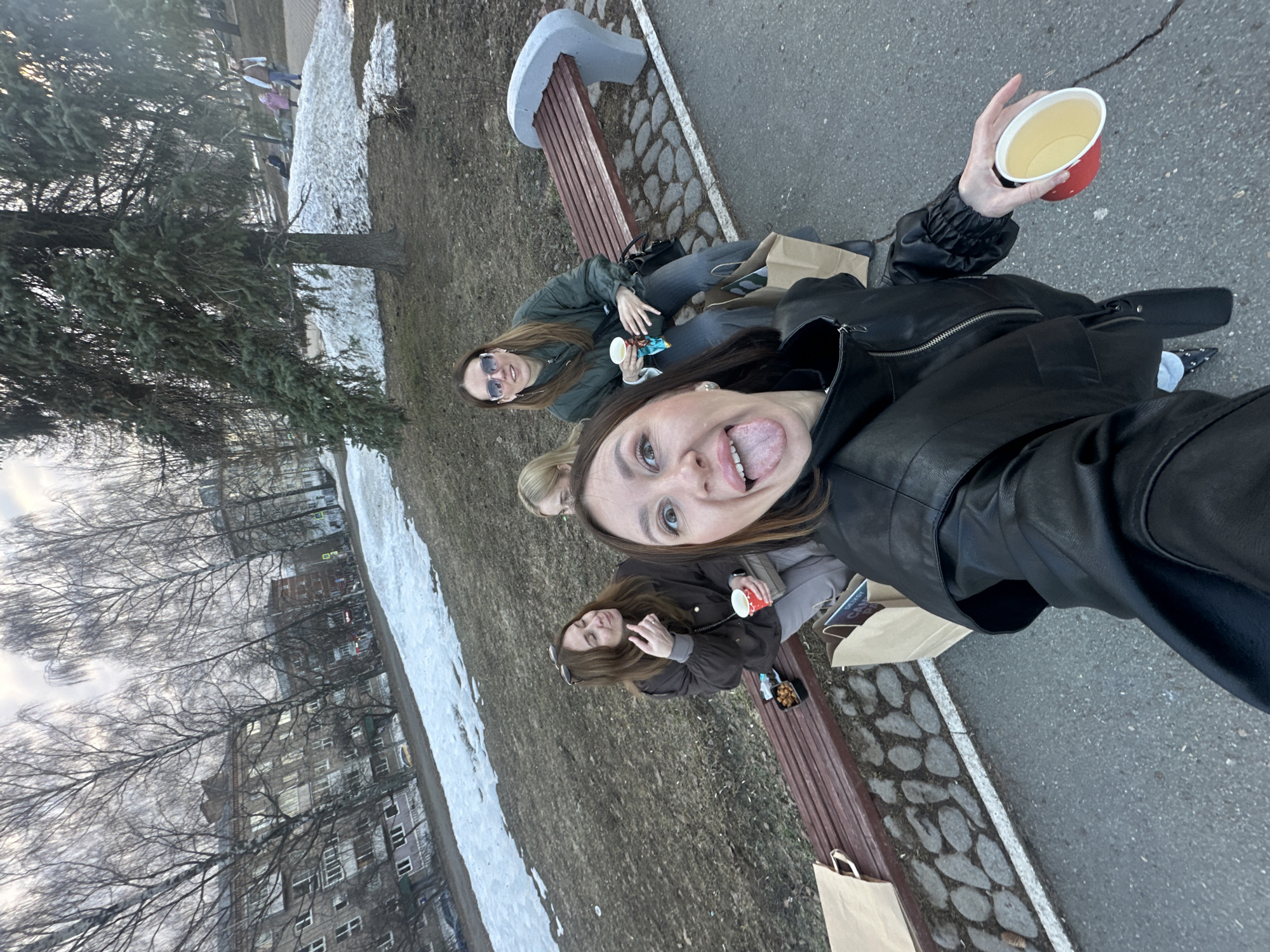 Four women share drinks, selfies on Izhevsk park bench