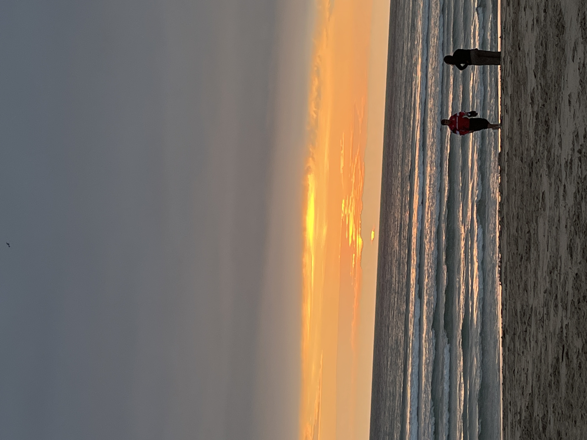Sunset beach walk captured in A Coruña, Spain