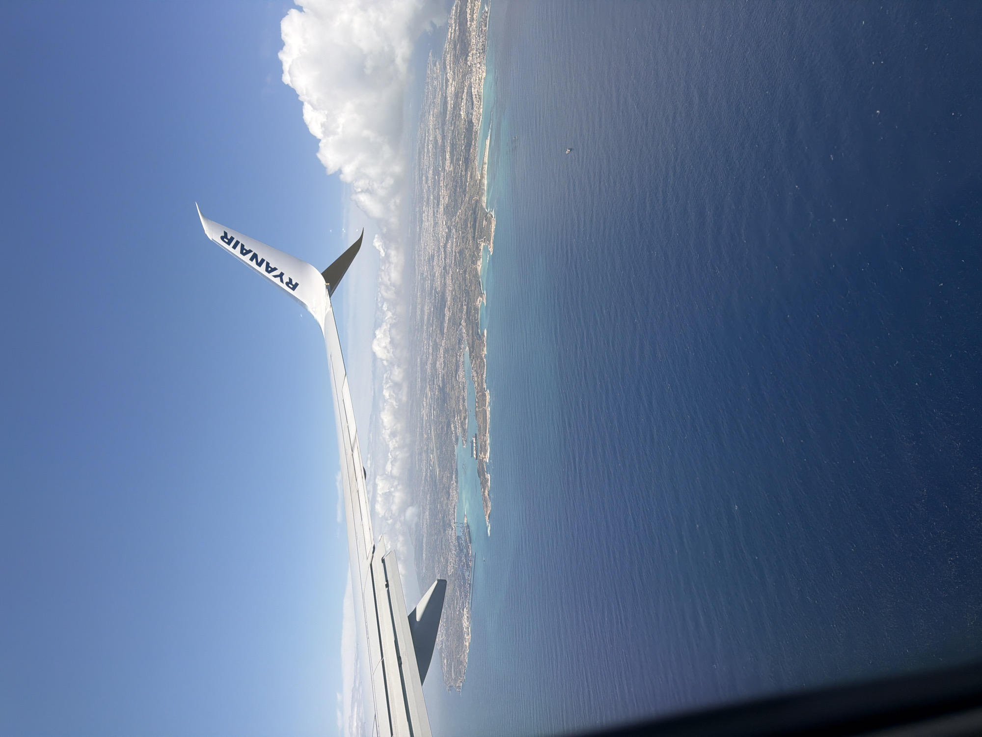 Aerial view of Malta coast captured from Ryanair flight