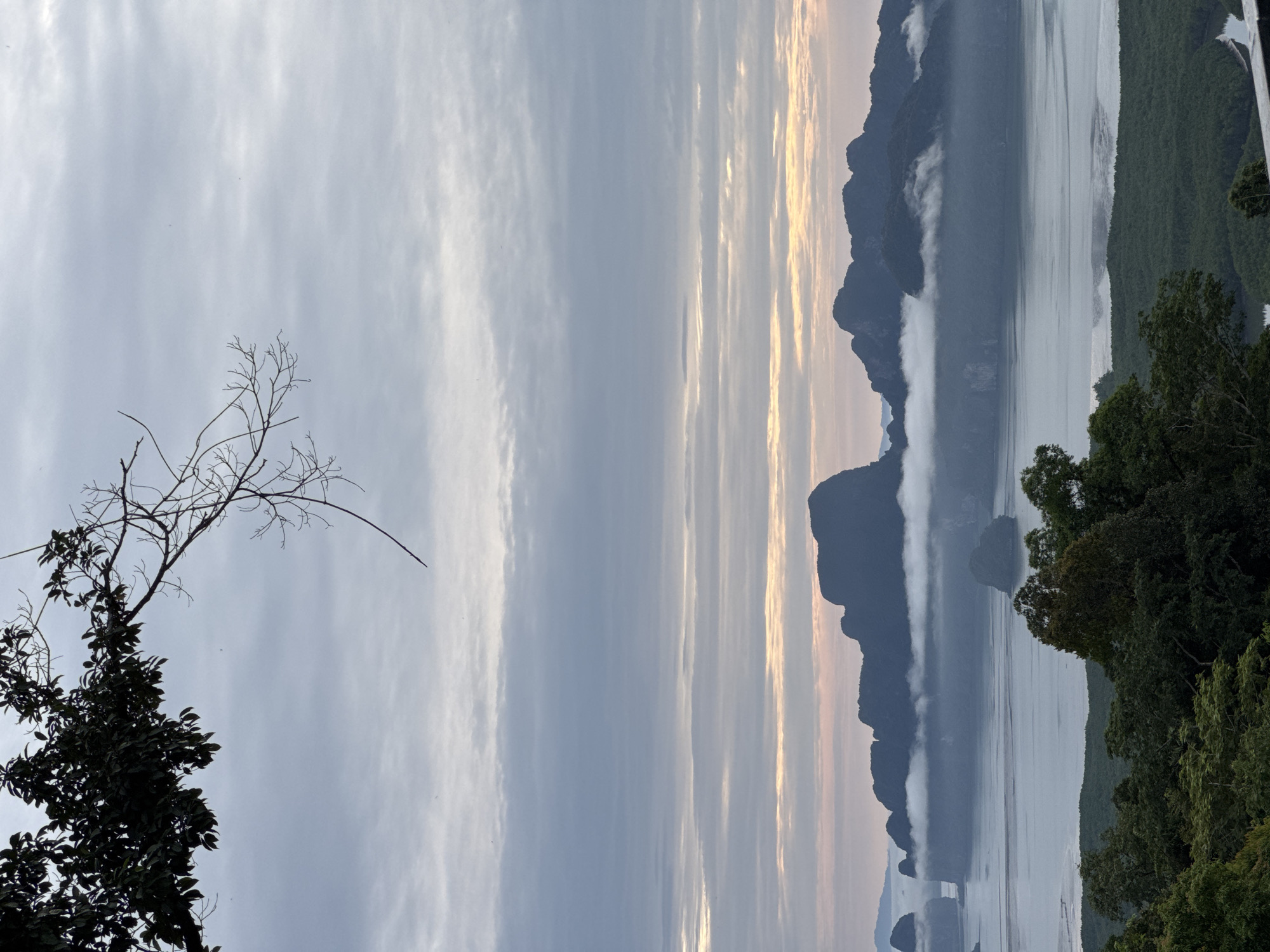 Misty bay views over Ban Hin Rom's mangrove coastline