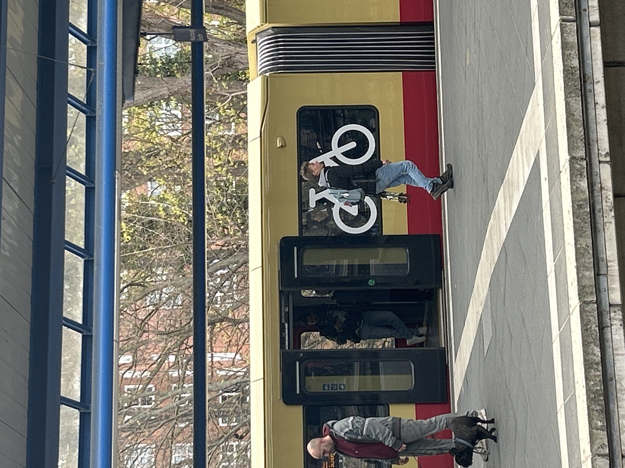 S-Bahn train stops at Berlin platform with passengers present