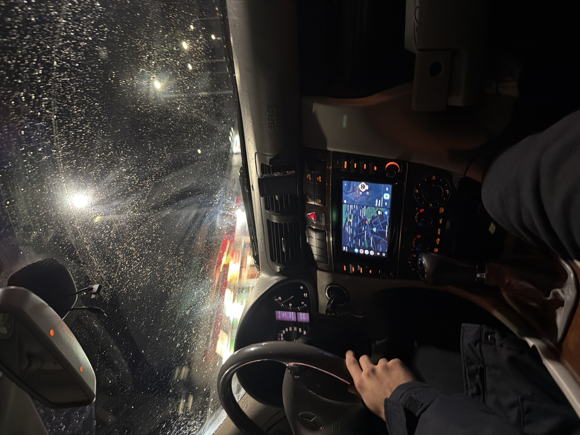Driver navigates through night weather conditions