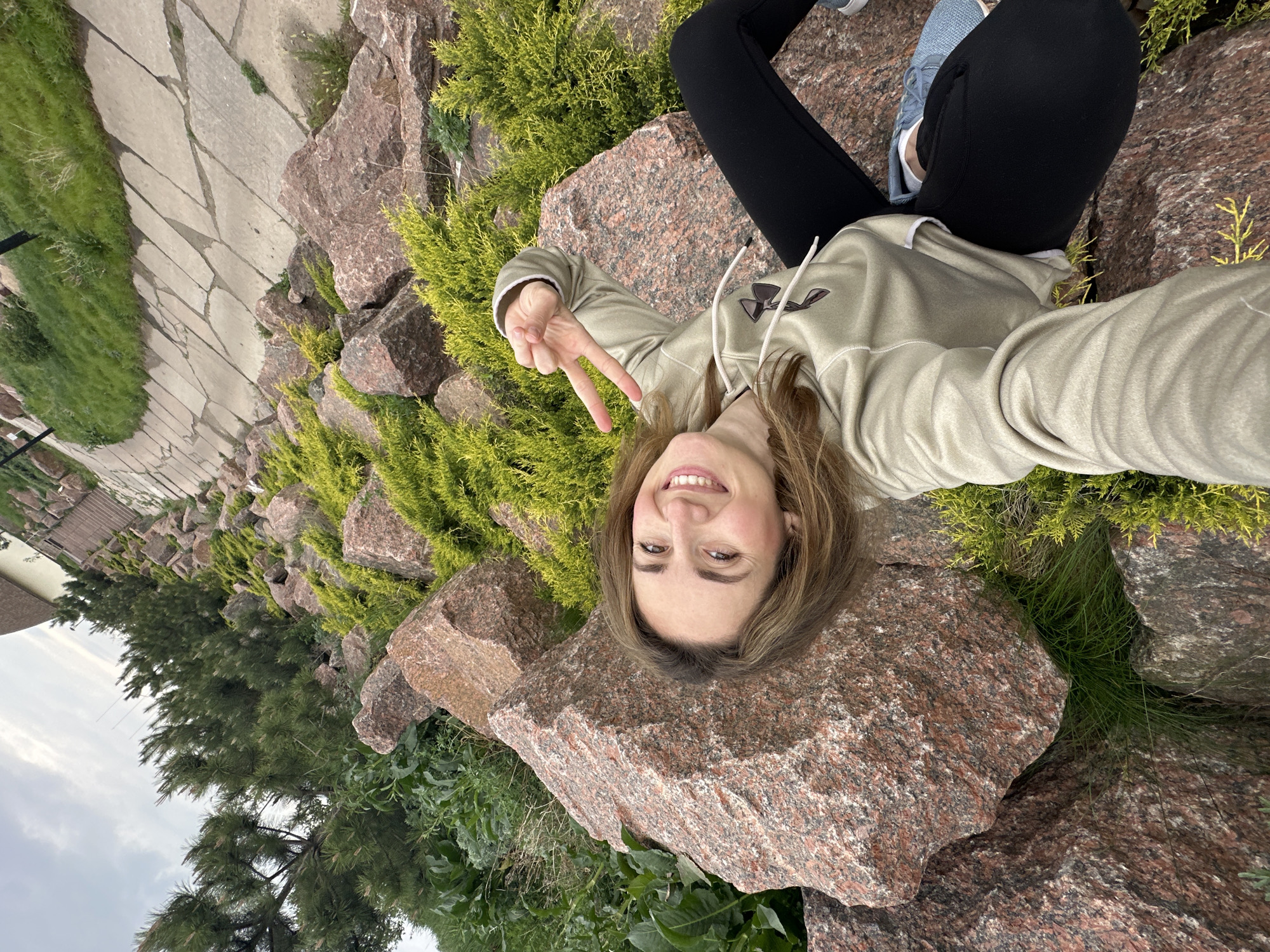 Two women pose for photos at Zakharivka rock formations