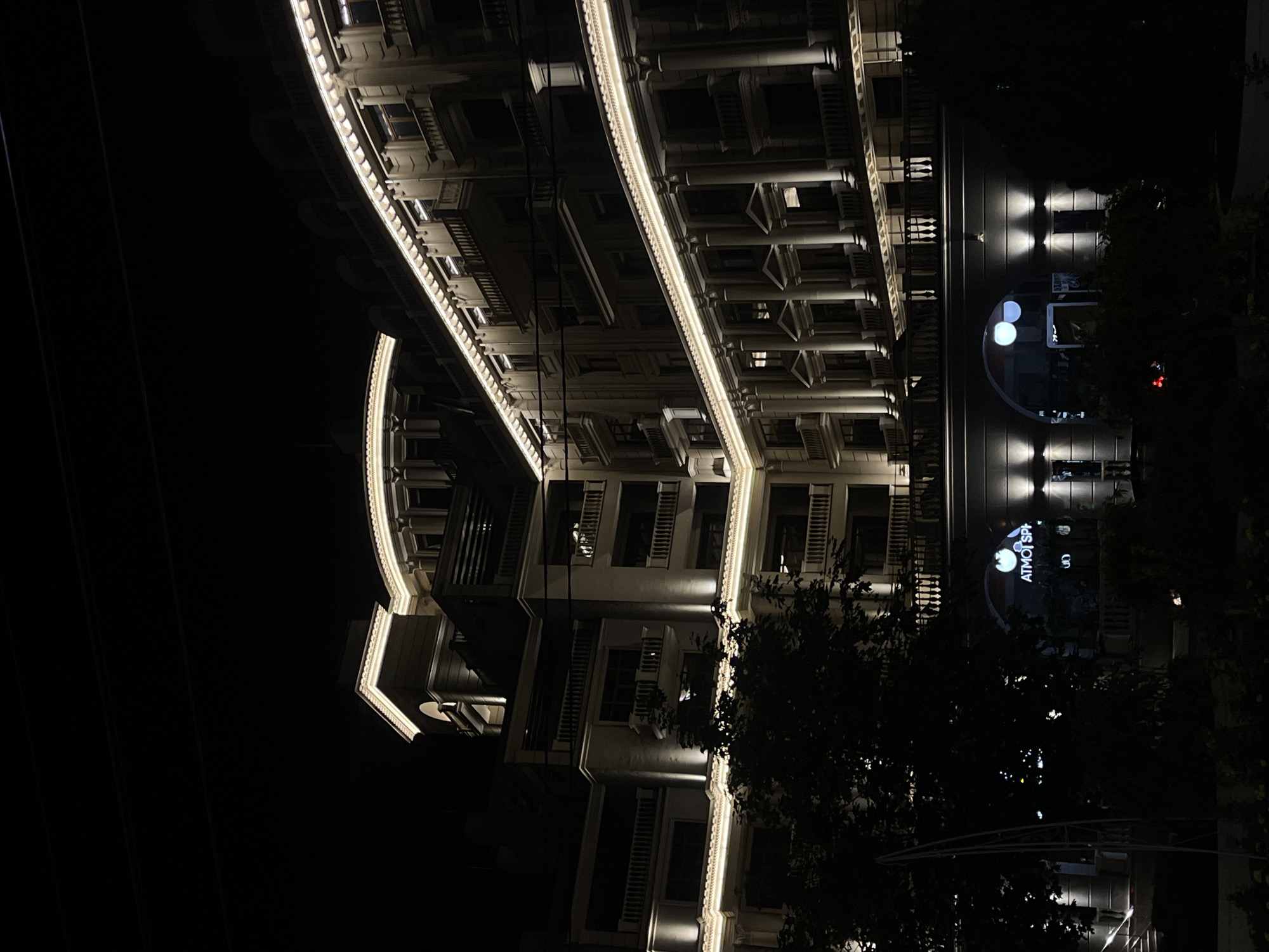 Evening illumination captures central Tiraspol's commercial district architecture