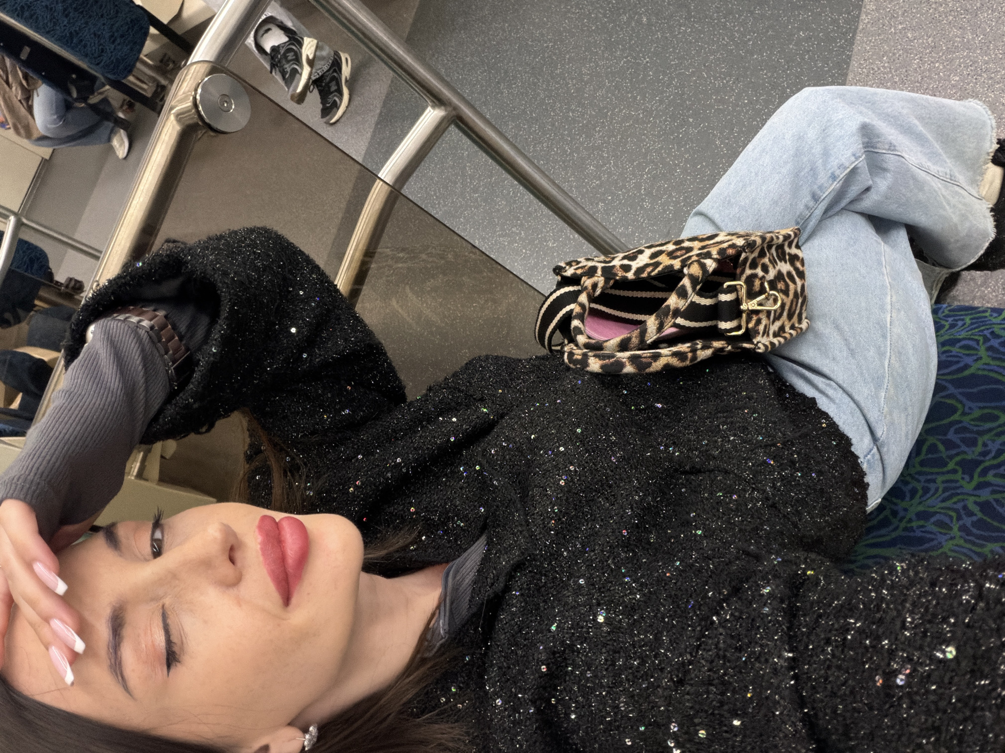 Woman rests on subway seat in Saint Petersburg
