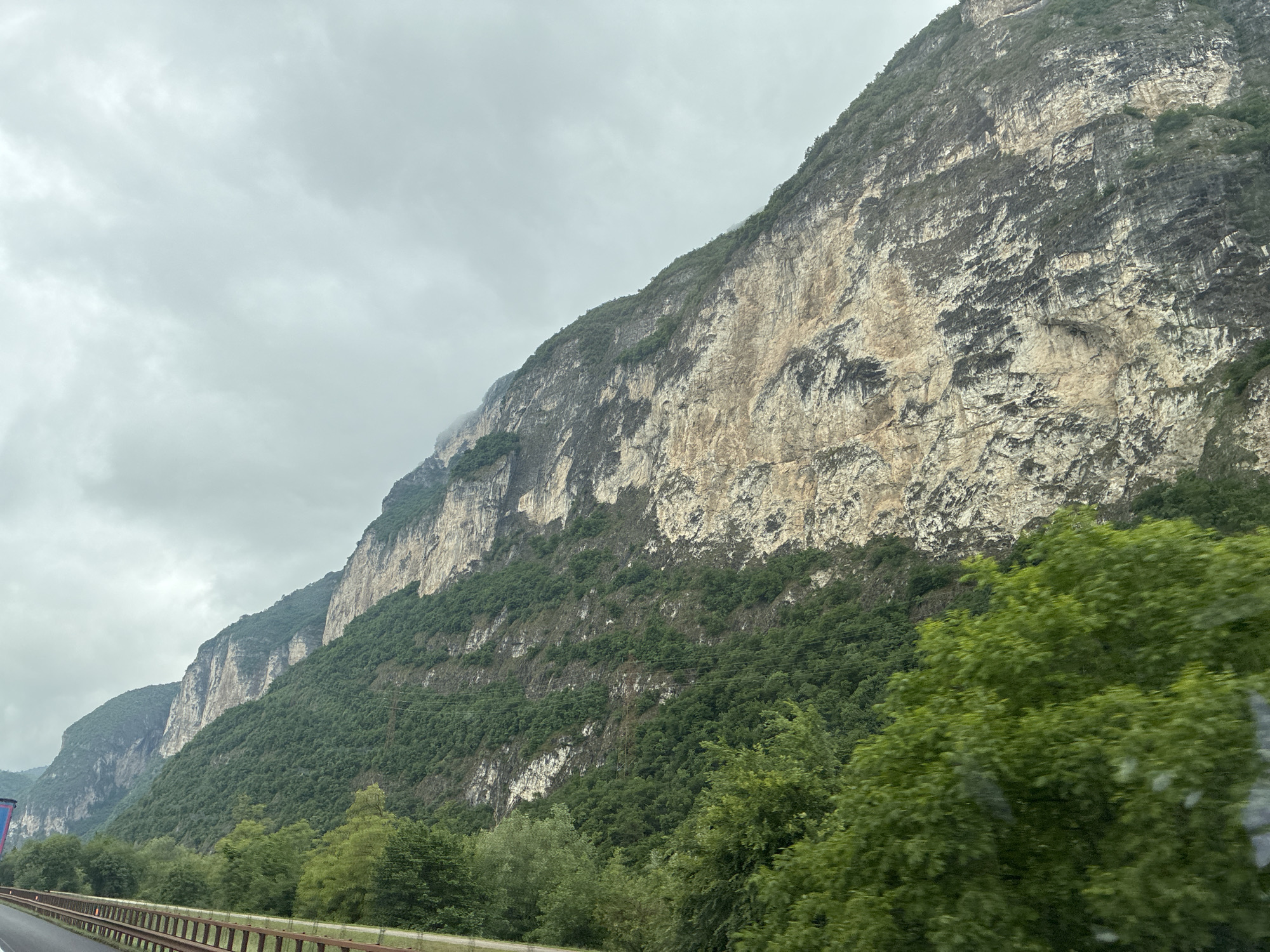 Mountainside view captured from vehicle in Trento, Italy