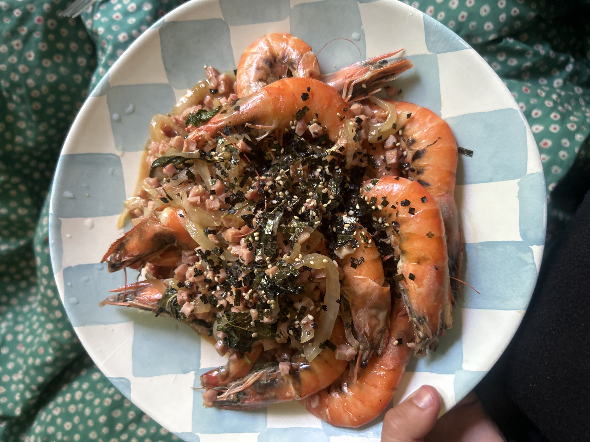 Prepared shrimp dish observed on floral fabric in LA