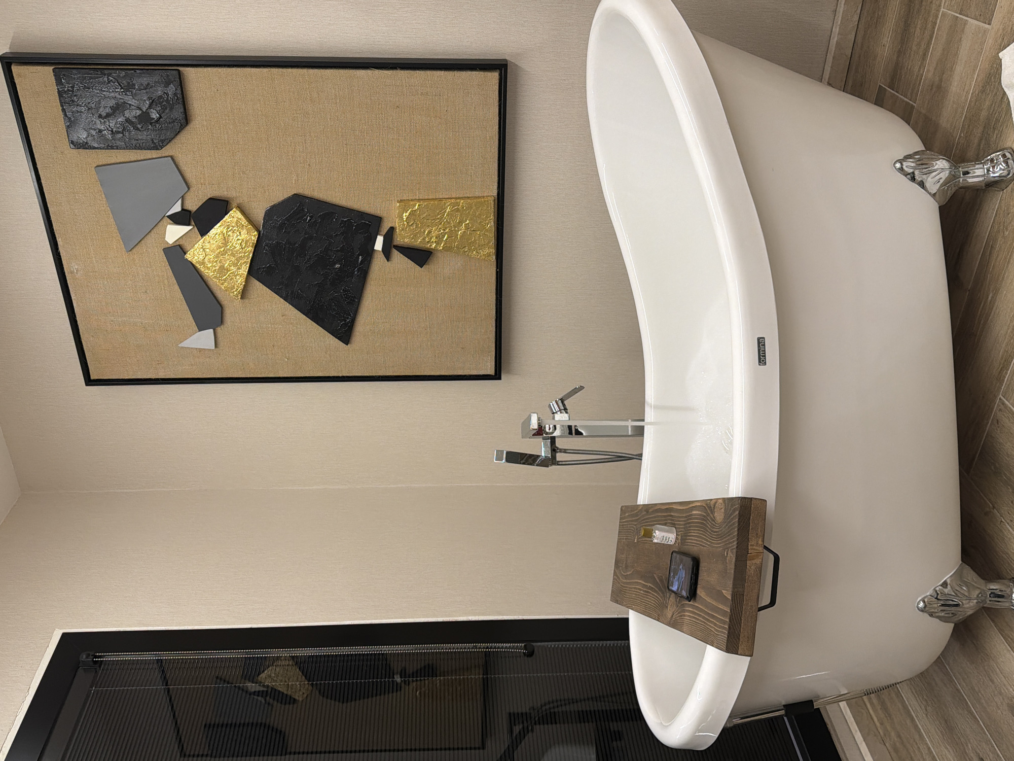 Modern interior spaces with bathtub and floral arrangements documented