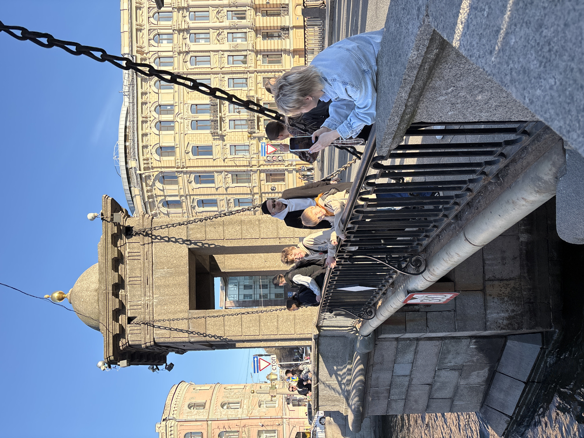 Afternoon tourist activity captured around Saint Petersburg's Palace Bridge