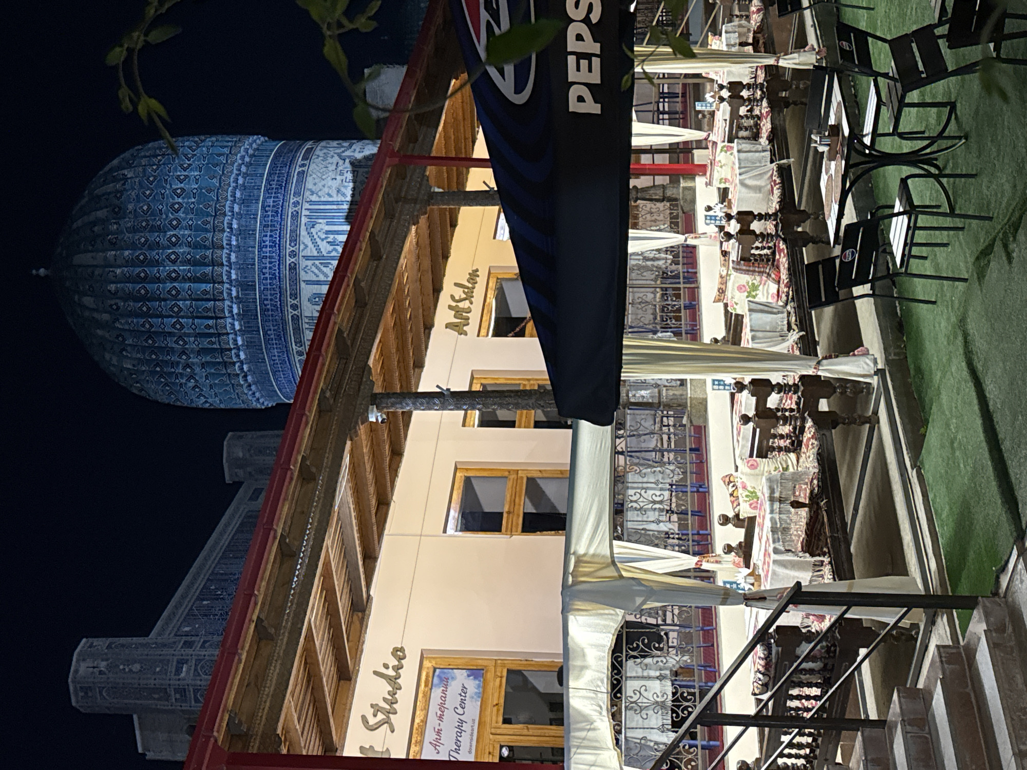 Tourist moments captured near historic Samarkand mausoleum, art salon