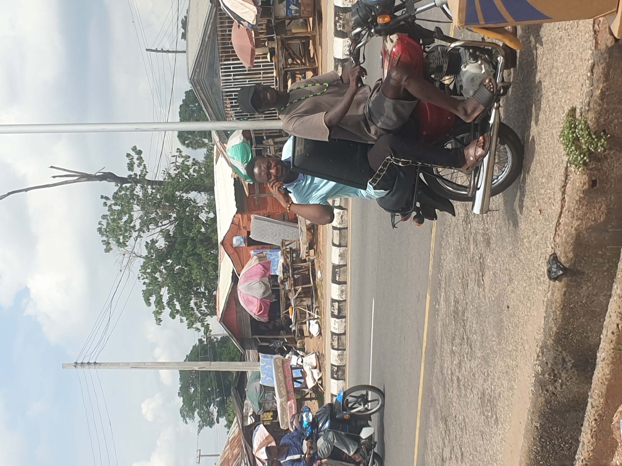 Urban street scene with motorcycles, construction equipment observed