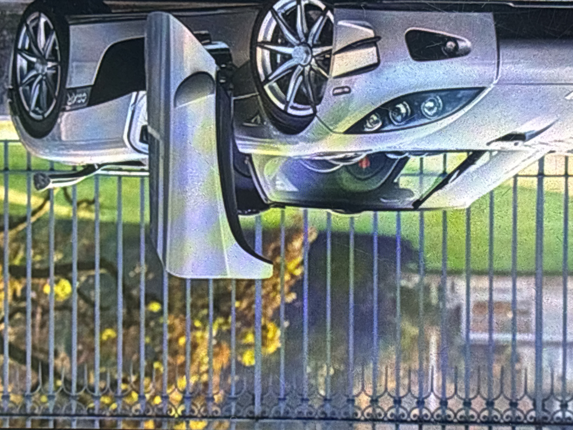 Parked silver car and trolleybus traffic observed in Sofia