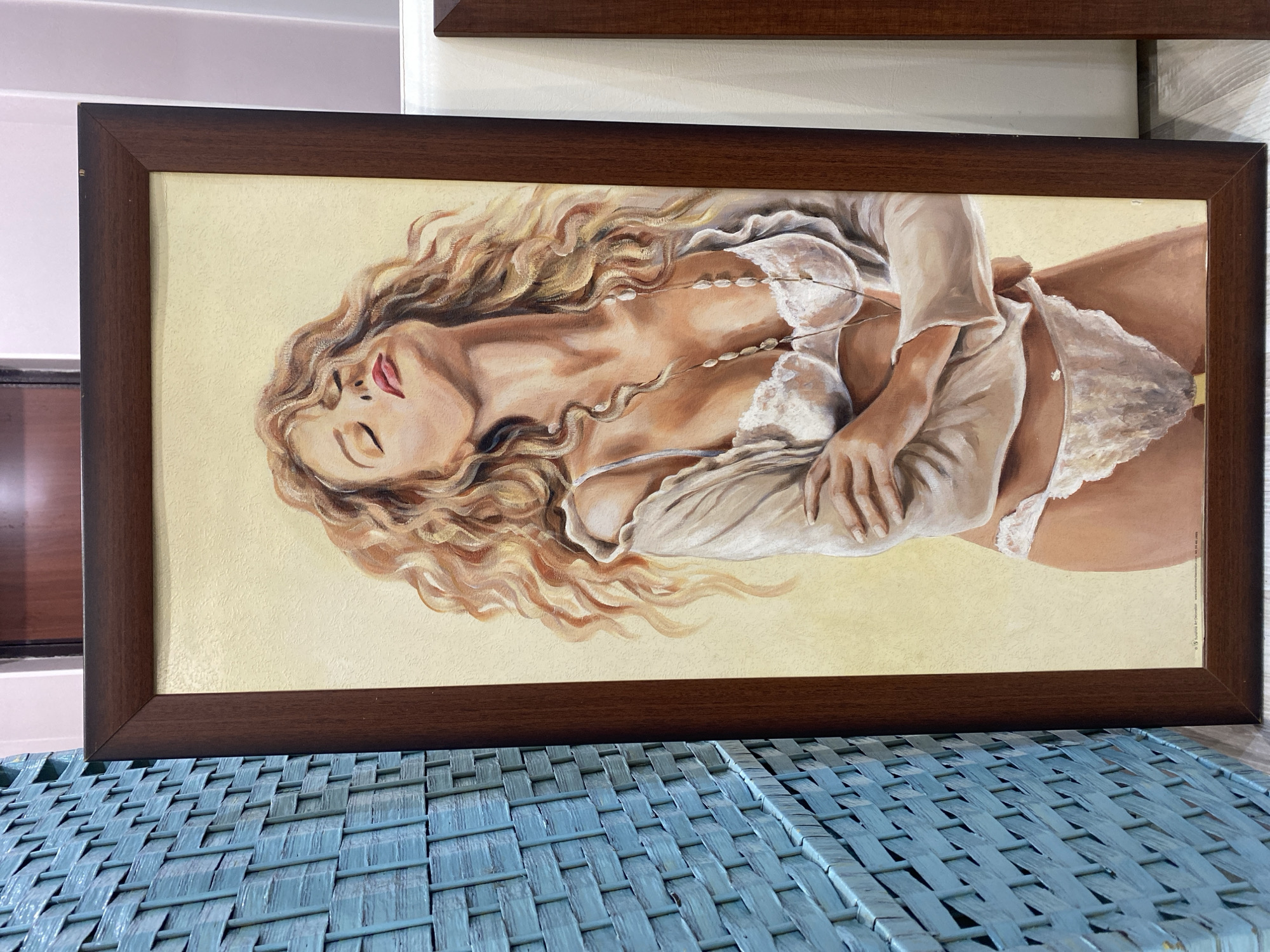 Art collection featuring reclining female figures displayed indoors