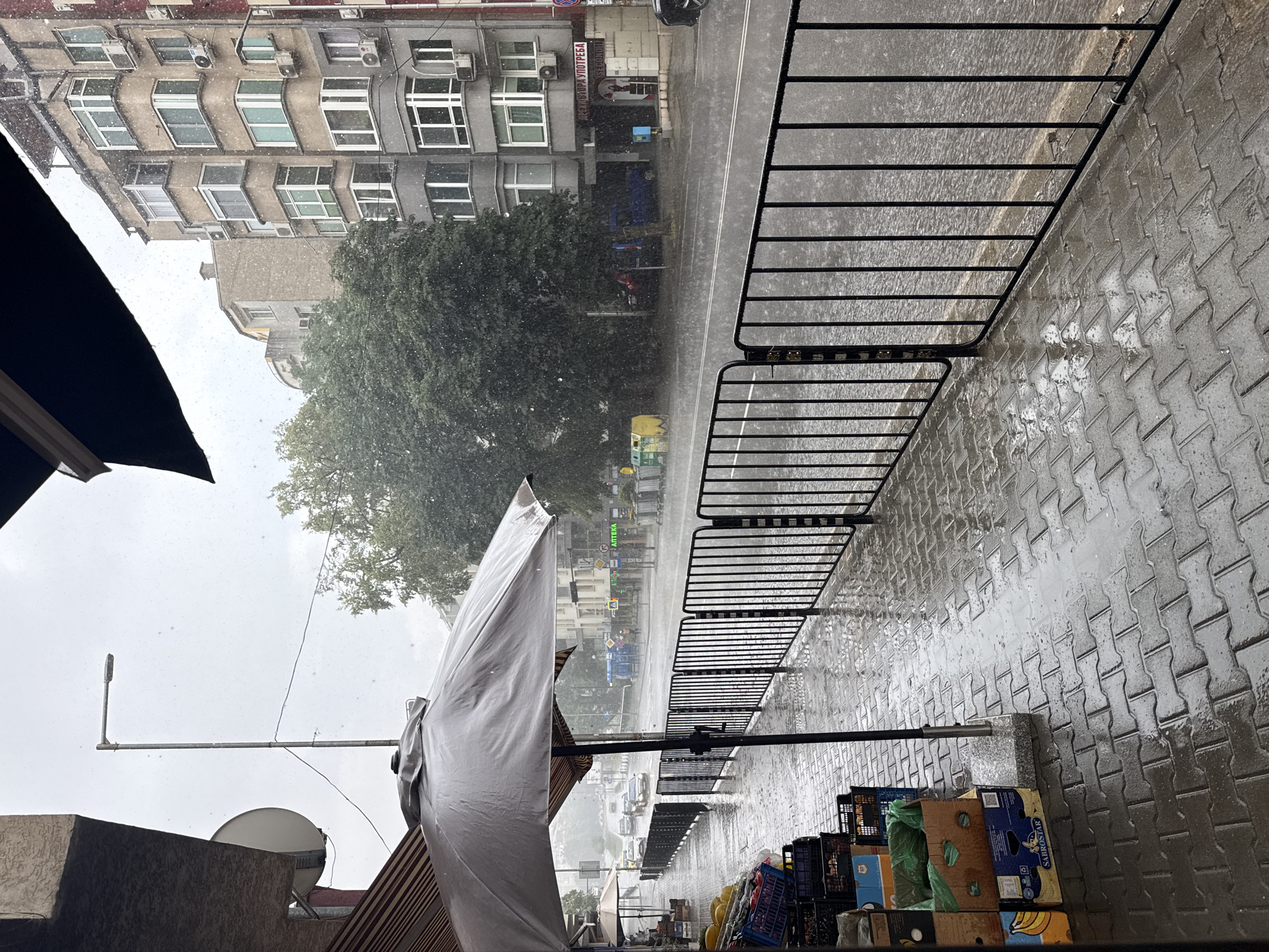 Heavy rain hits a Blagoevgrad street on a June afternoon