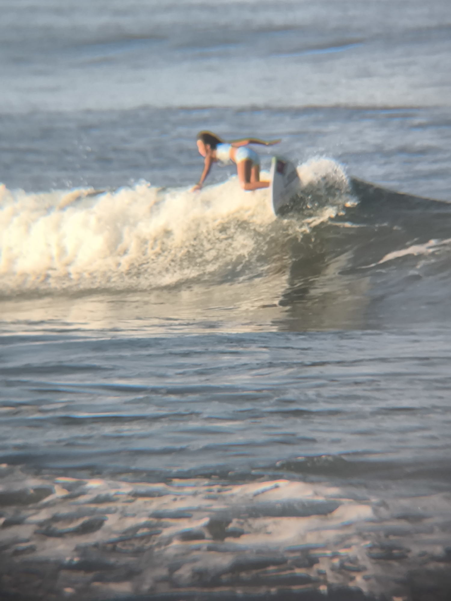 Evening surf session draws multiple participants to North Kuta beach