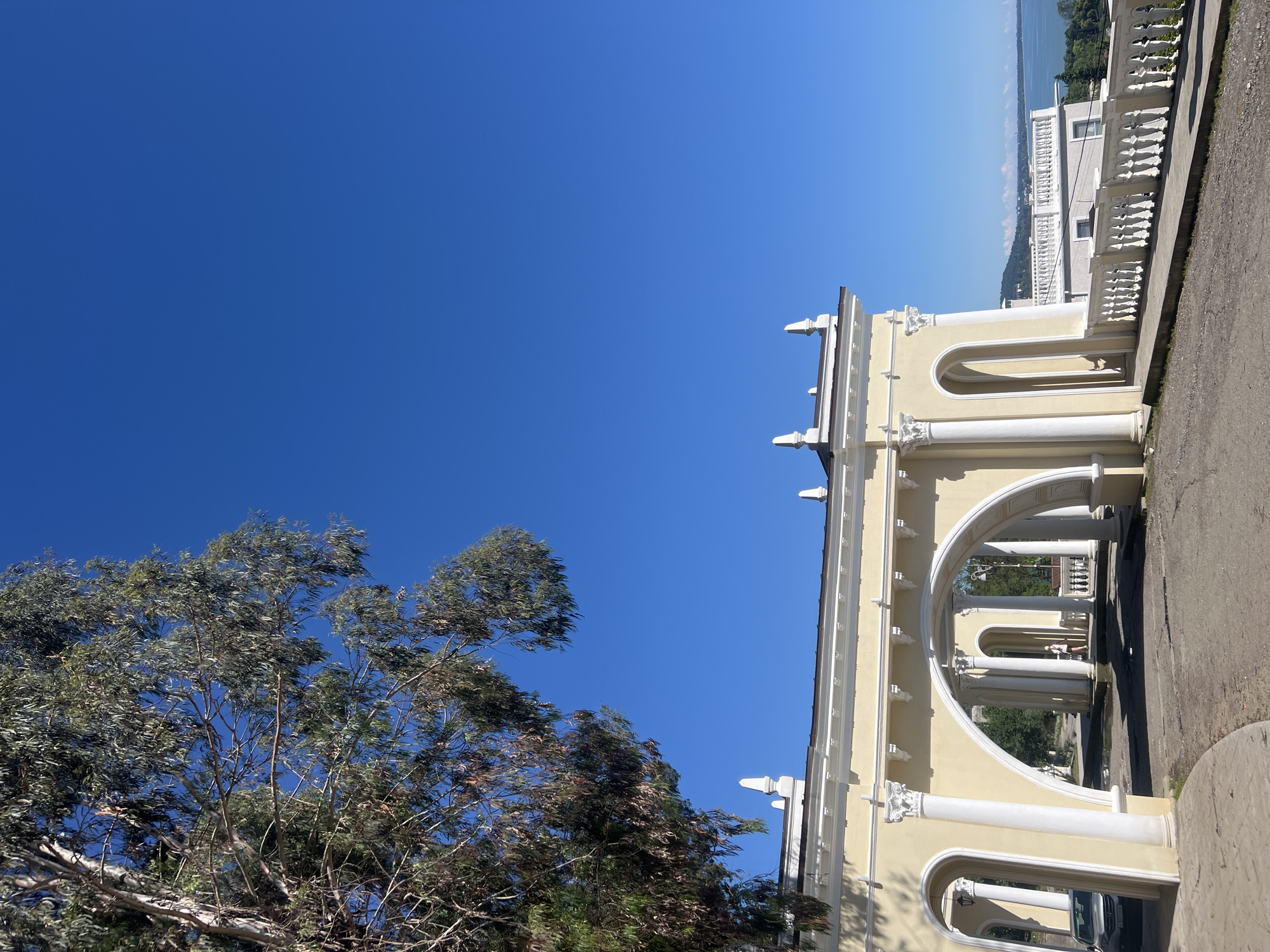 Coastal city panorama captured during clear afternoon in June