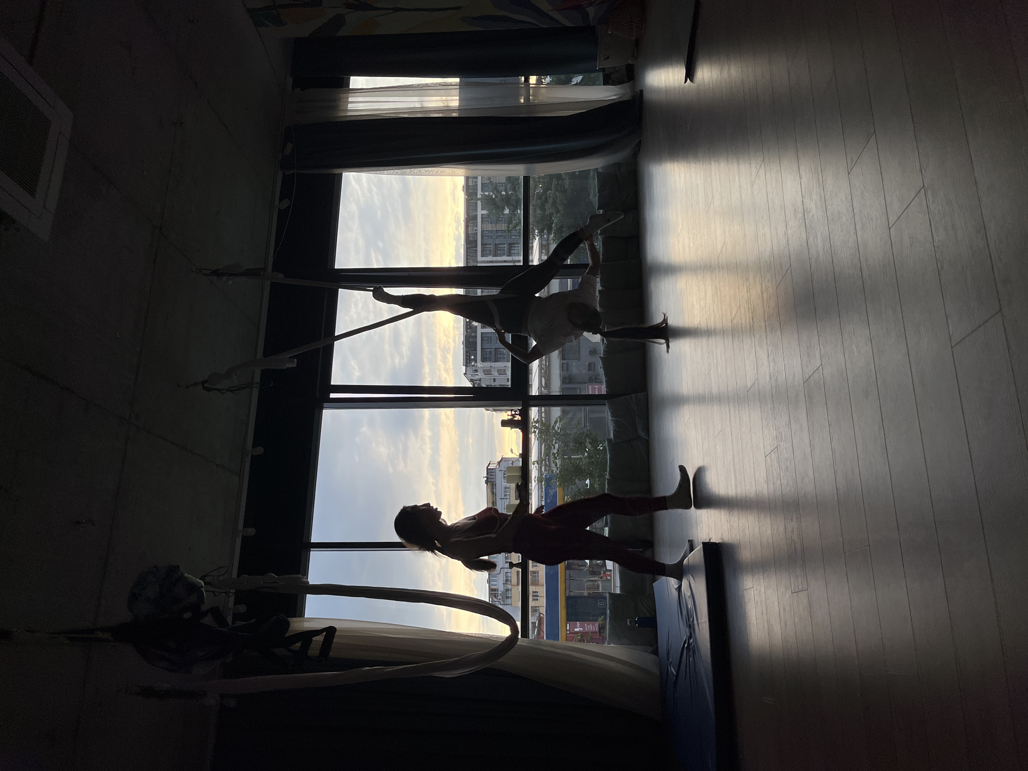 Aerial yoga sessions capture Sofia sunset from studio windows