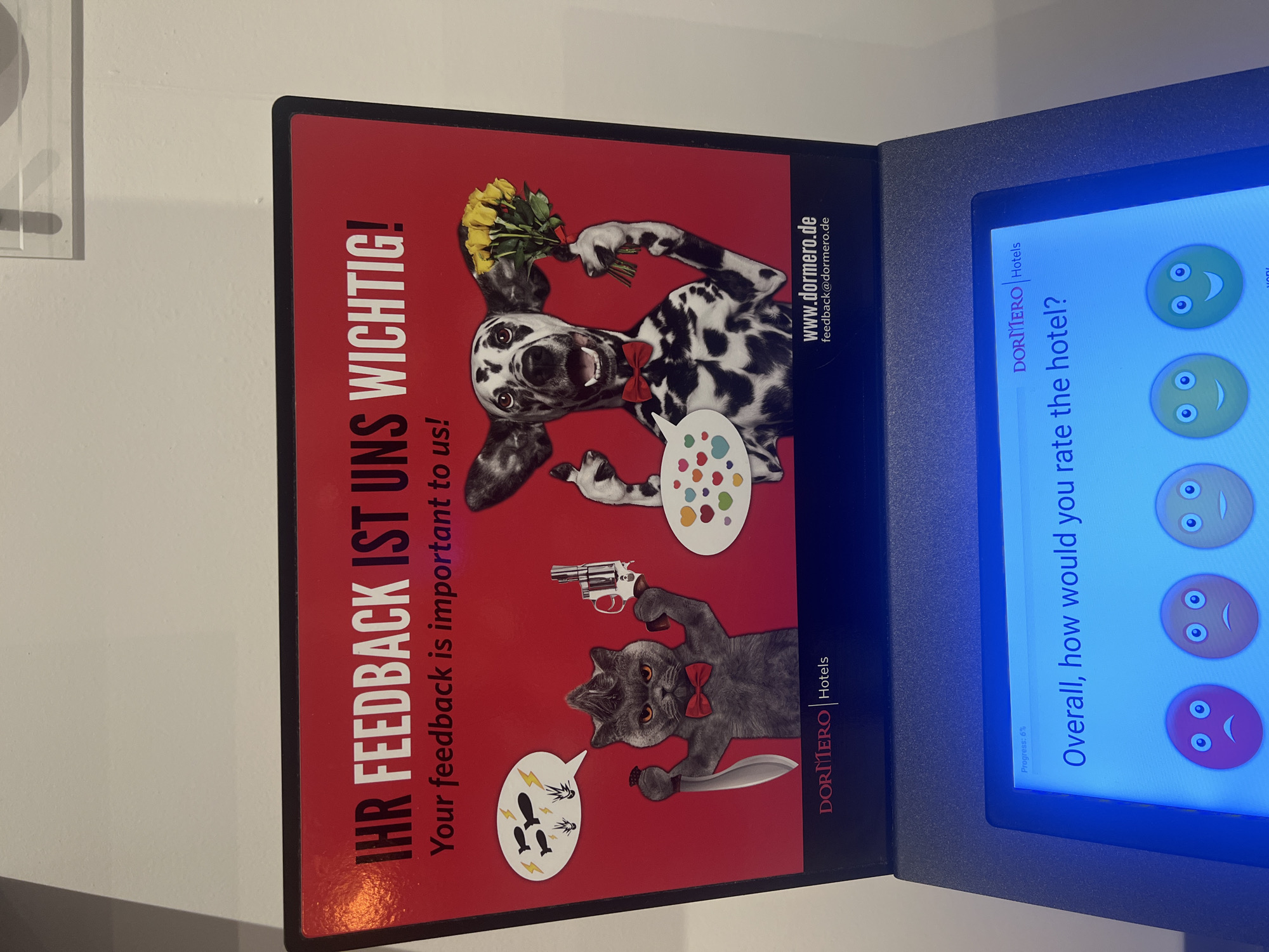 Hotel feedback station displays unusual cartoon advertisement in Budapest