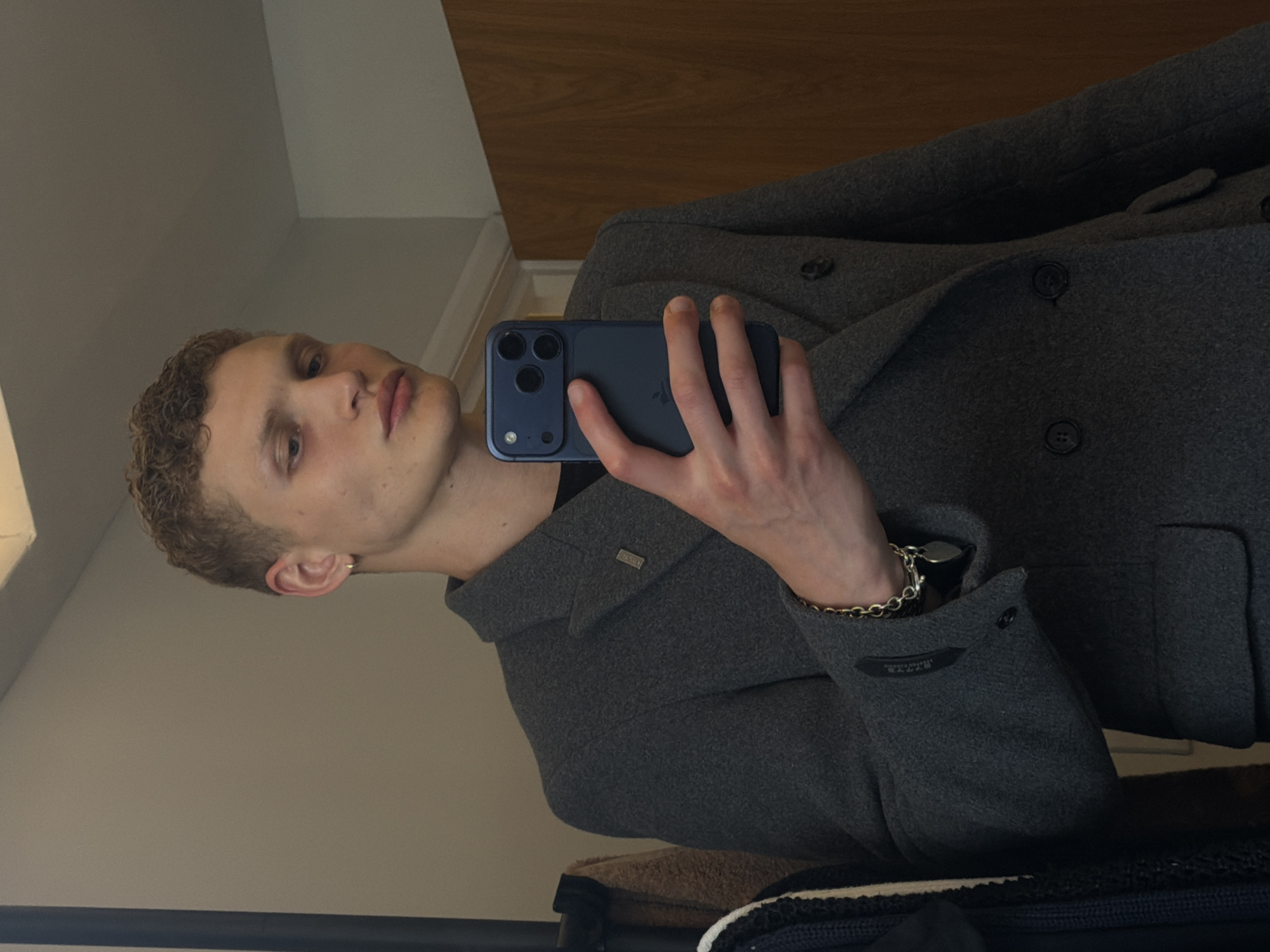 Young man takes mirror selfie in London