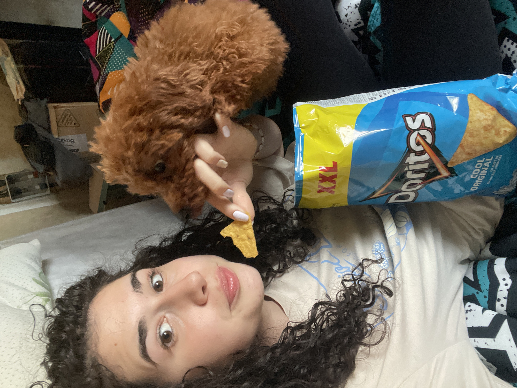 Person shares snack time with poodle in Sofia home