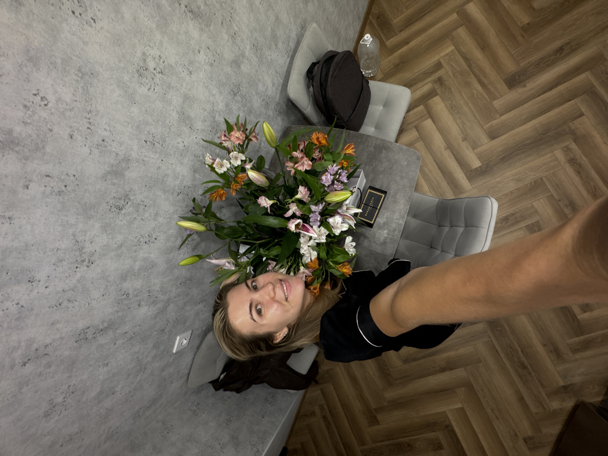 Indoor celebration with flowers, 23rd birthday decorations, stones documented