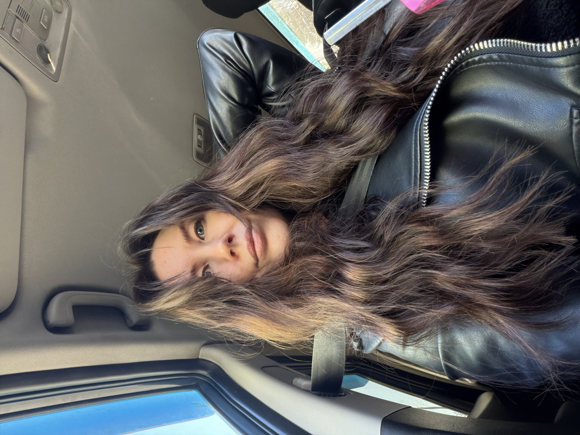 Woman photographed in car passenger seat in Perm