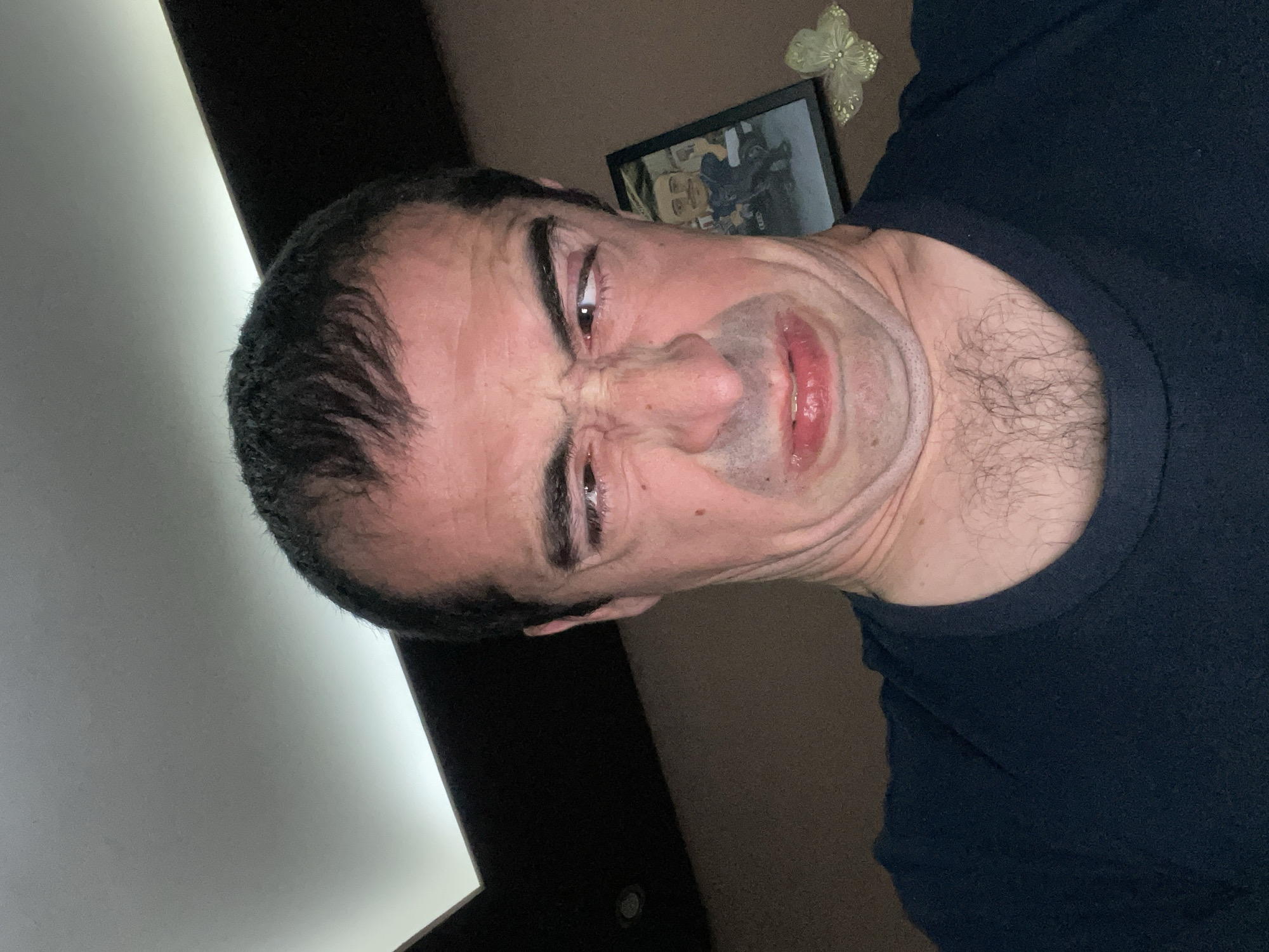 Man makes faces for camera in Sofia apartment